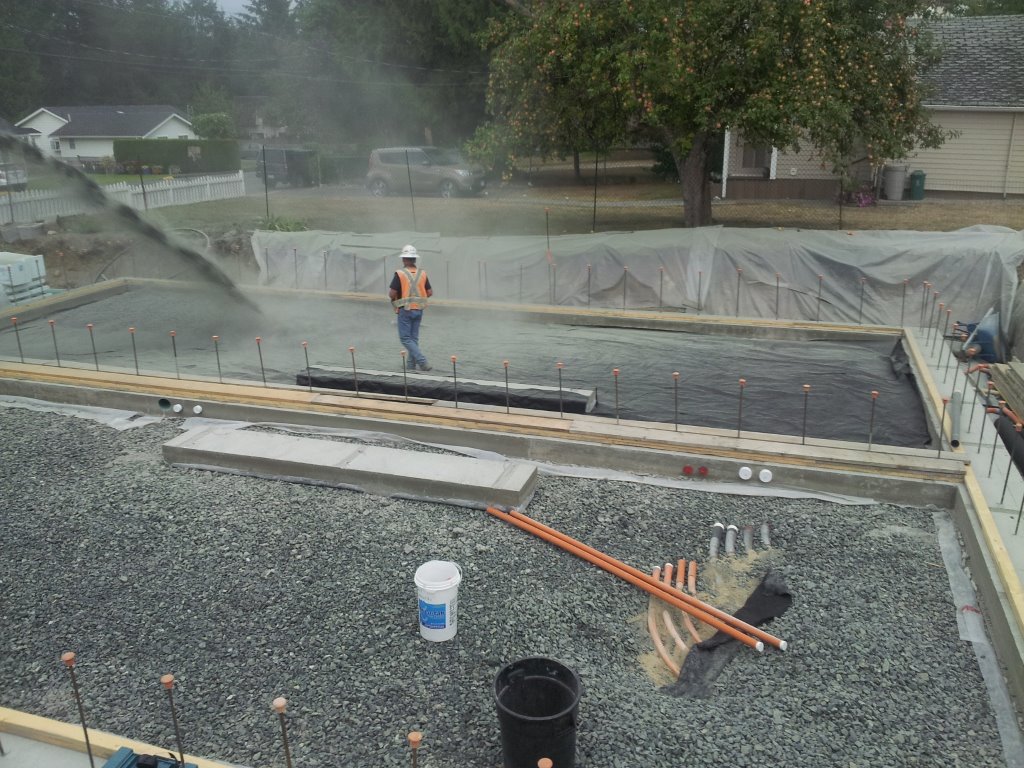 Once our perfectly level footings are poured we then add another 10 inches of drain rock.
