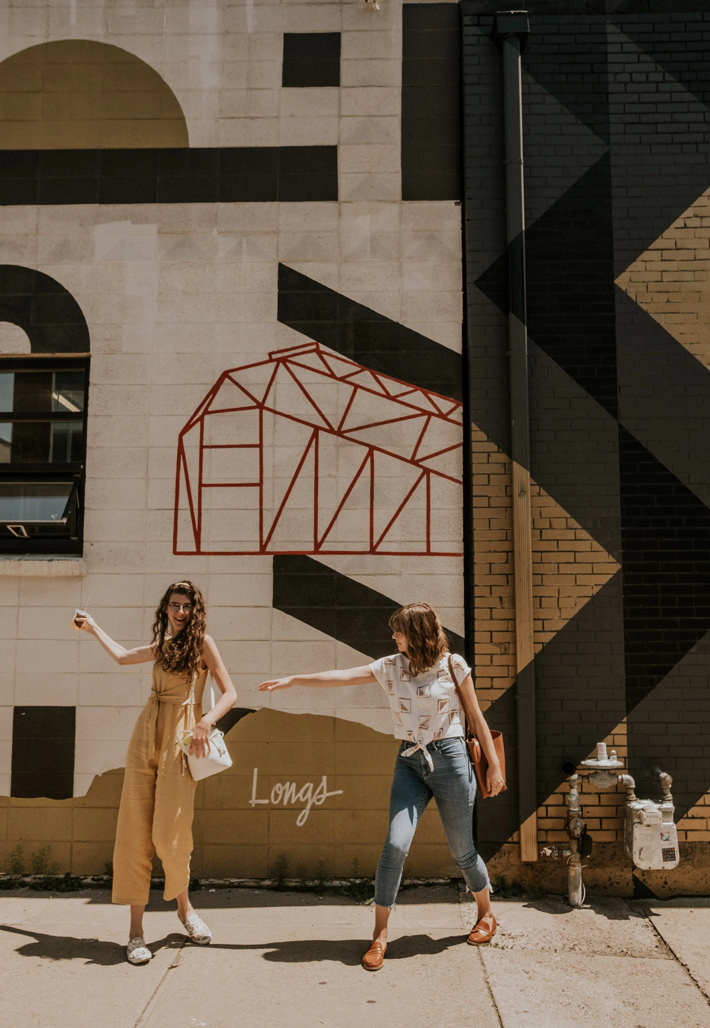 Amanda (left): Wearing a custom Sally Jumper with Ties in Mustard Linen Anna (right): Wearing a custom block printed Madeleine Linen Top with ties