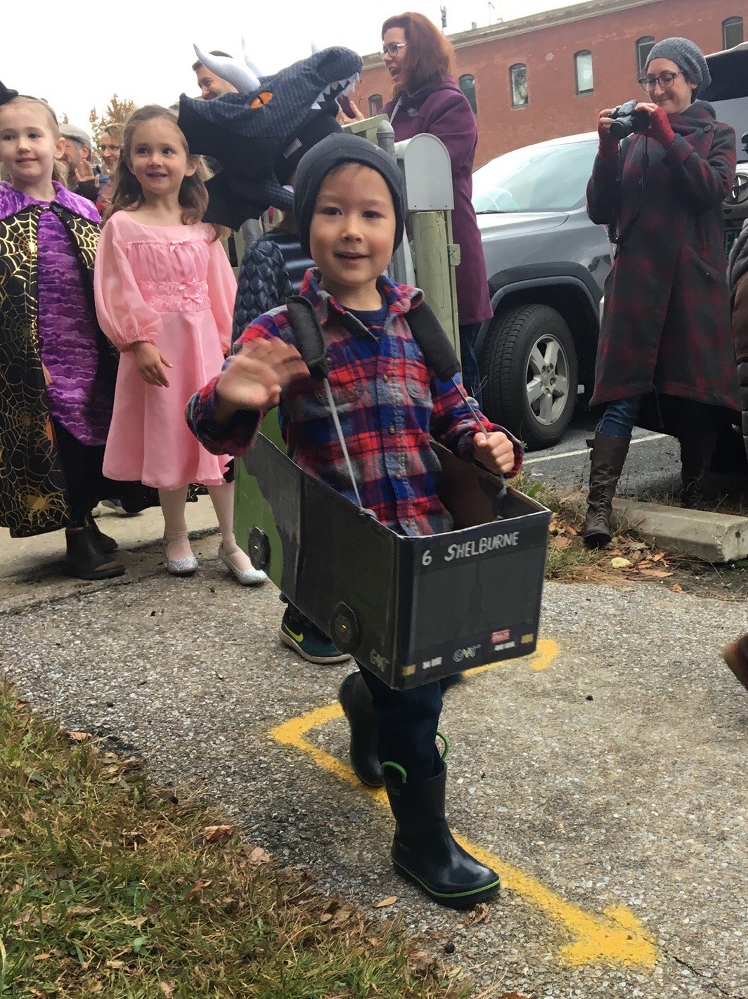A young bus enthusiast showing off his No. 6 bus Halloween costume