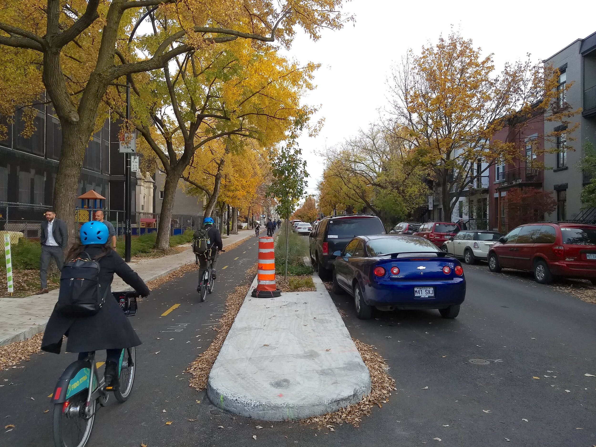 Ten years from now, Montreal would like 15% of all trips in the city to be made by bike. An effective way to get a broader range of people on bikes is to protect them from moving traffic with a barrier. Photo: Jon Kaplan