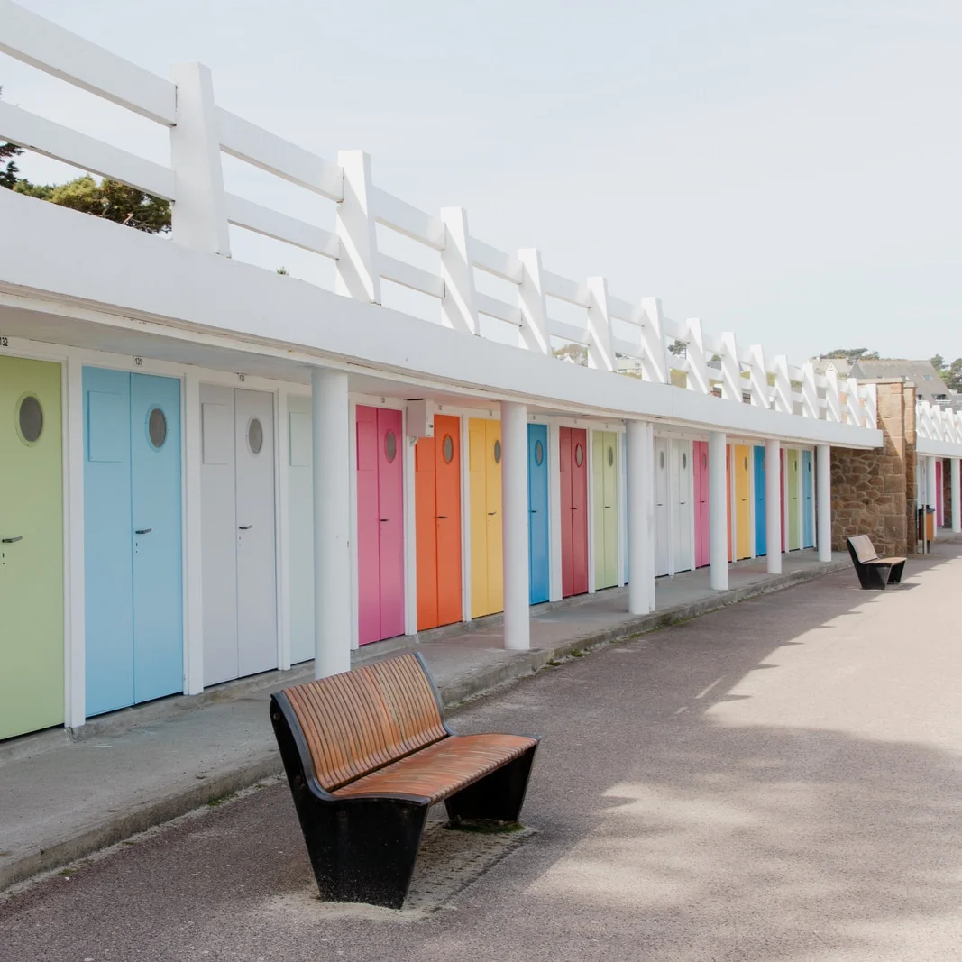 Row of changing cabins with doors in different kind of colors