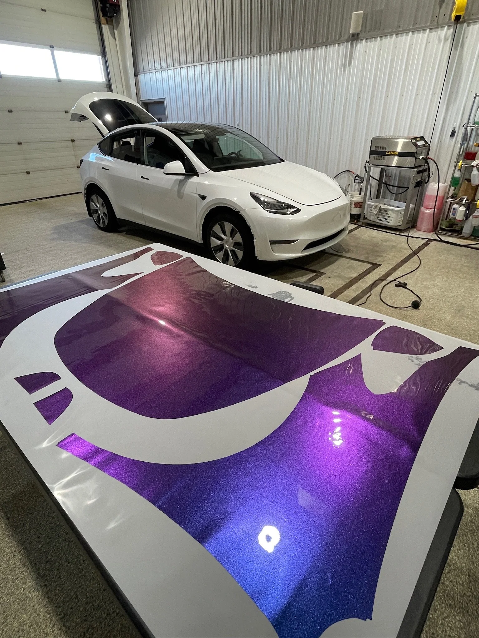 Dare to drive BOLD! This lucky Tesla Model Y got not only upgraded, but completely transformed from a mundane white to a beautiful irridescent color scheme with a color changing film! #rosedetailing #tesla #colorchange
