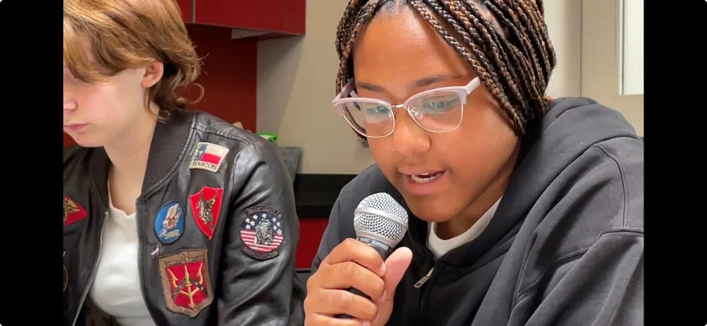 Zoe sharing an excerpt of her new novel at our book release party in May