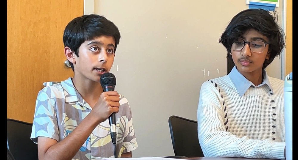 Amar sharing an excerpt of The Heist at our book release party in May