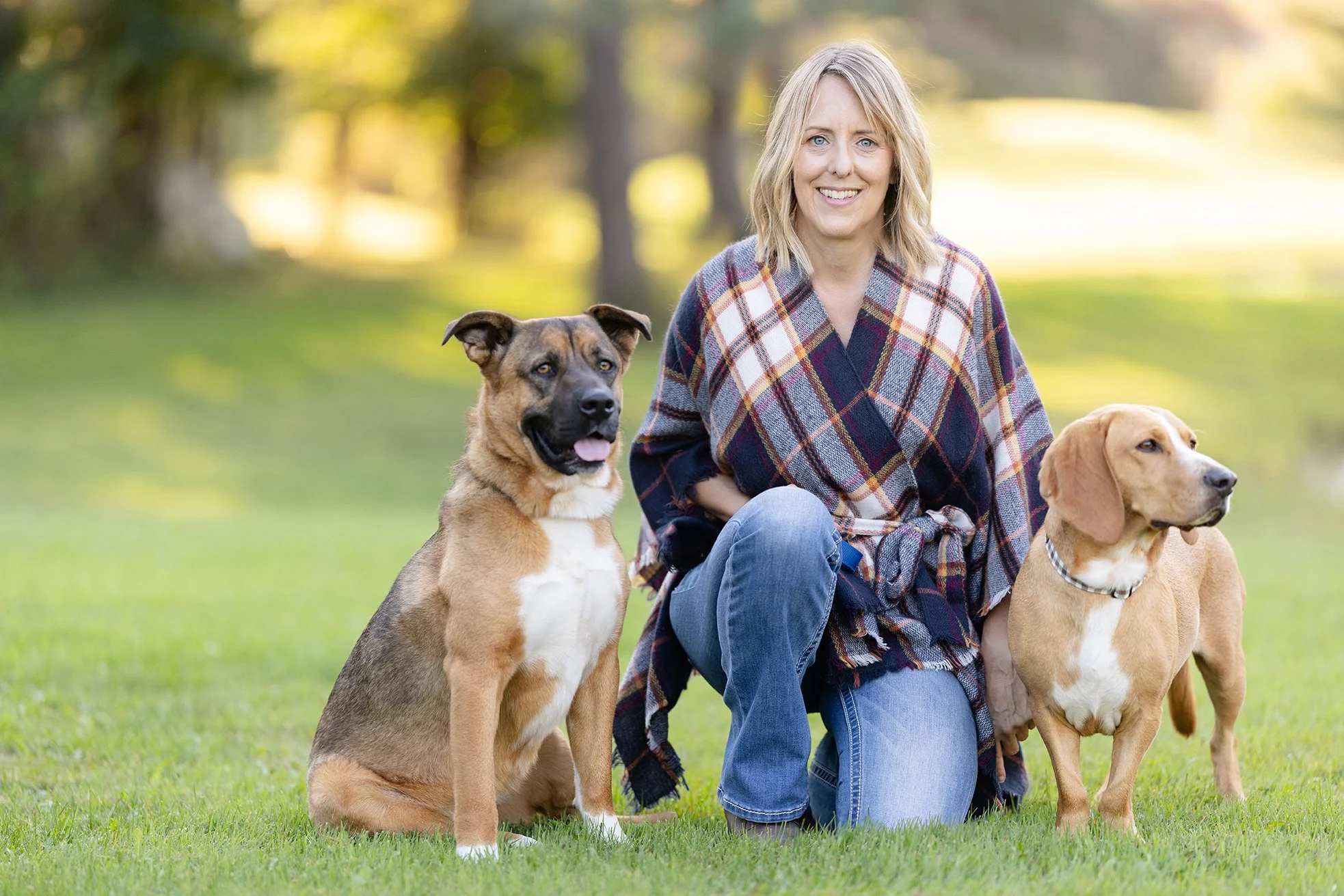 Two dogs and their owner pose for photography in Wisconsin
