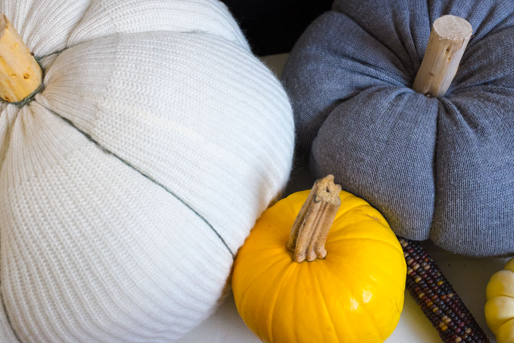 STEP 5 (optional): Create indentations around the pumpkin by either sewing long stitches through the top and bottom then pulling to form the indent. For the white pumpkin, I opted to simply wrap thin twine around the pumpkin because it was just too big to sew through.
