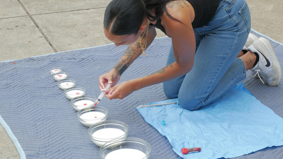   How Many Drops,  2018 For Pittsburgh Performance Art Festival   For this piece, I utilized my blood as material to concentrate bowls of milk. I asked the question, how many drops of Black blood does it take until we begin to see erasure of whitenes