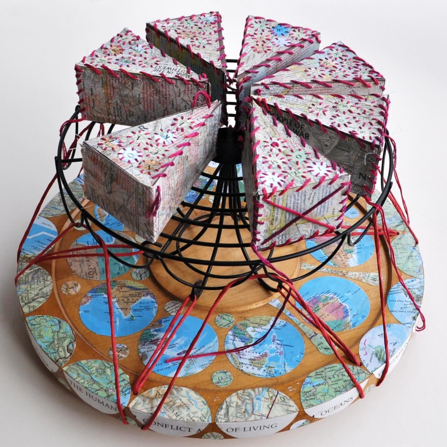 Our June 2025 Featured Artist is Sarah Simmons!

@sarah_simmons_bookgardener repurposes text and textile to release the untapped potential of materials and words by challenging their traditionally assigned purposes and roles. arah holds a BFA with a 