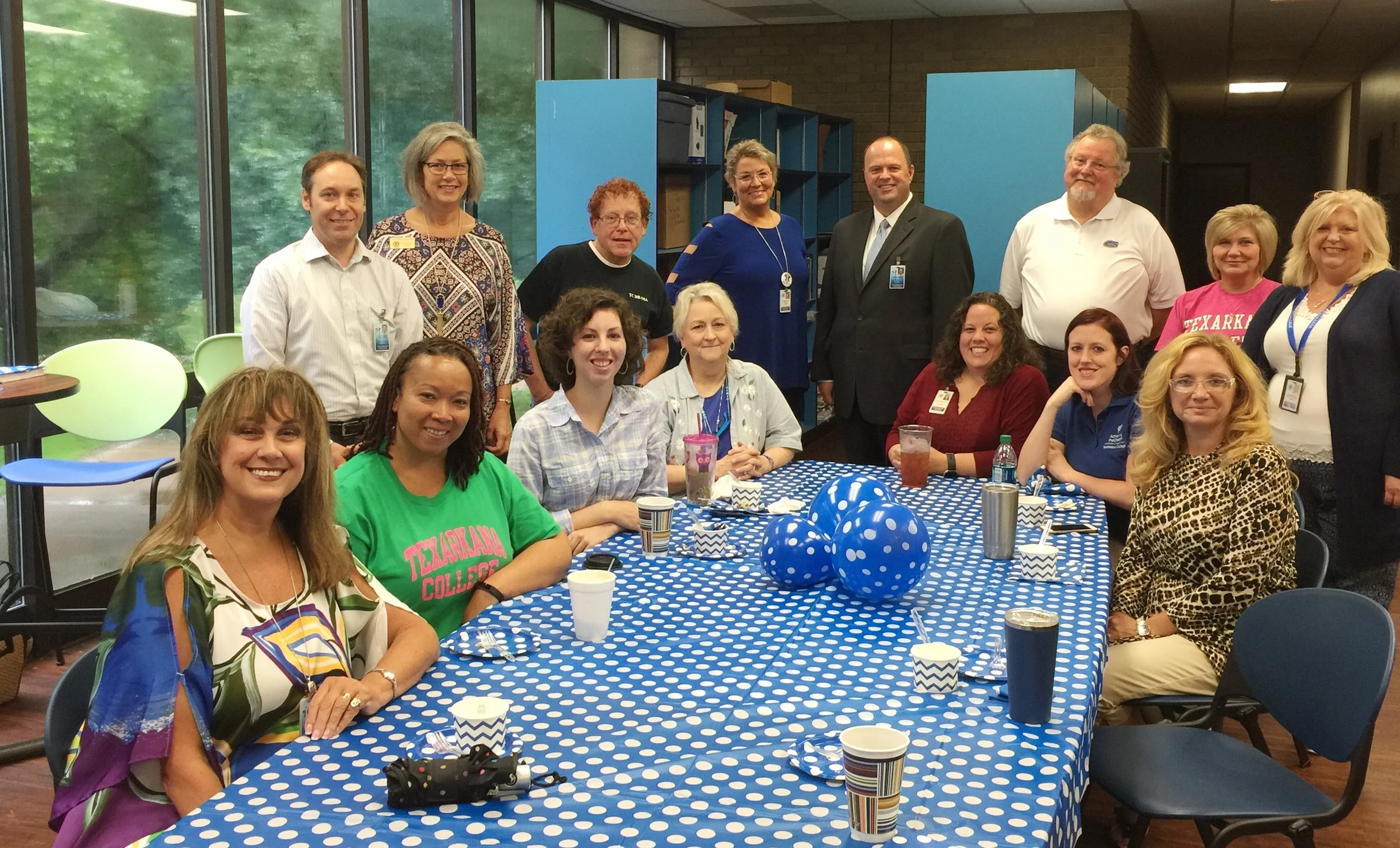 ^ Colleagues of Mary Ellen’s who work in the Liberal and Performing Arts Division Texarkana College are: (seated) Cindy Ramage, Laronda Bailey, Sally Ferguson (former adjunct), Valerie Owen, Patti Meyer, Kelli Reed, and Lisa Jones; (standing) Marc-Andre’ Bougie, Mary Scott Goode, Michael Cooper, Mary Ellen (dean), James Henry Russell (college president), Bill Owney (adjunct), Dee Dee Harrison (administrative assistant), and Pam Owney. (Not pictured is Alonza Mitchell) 