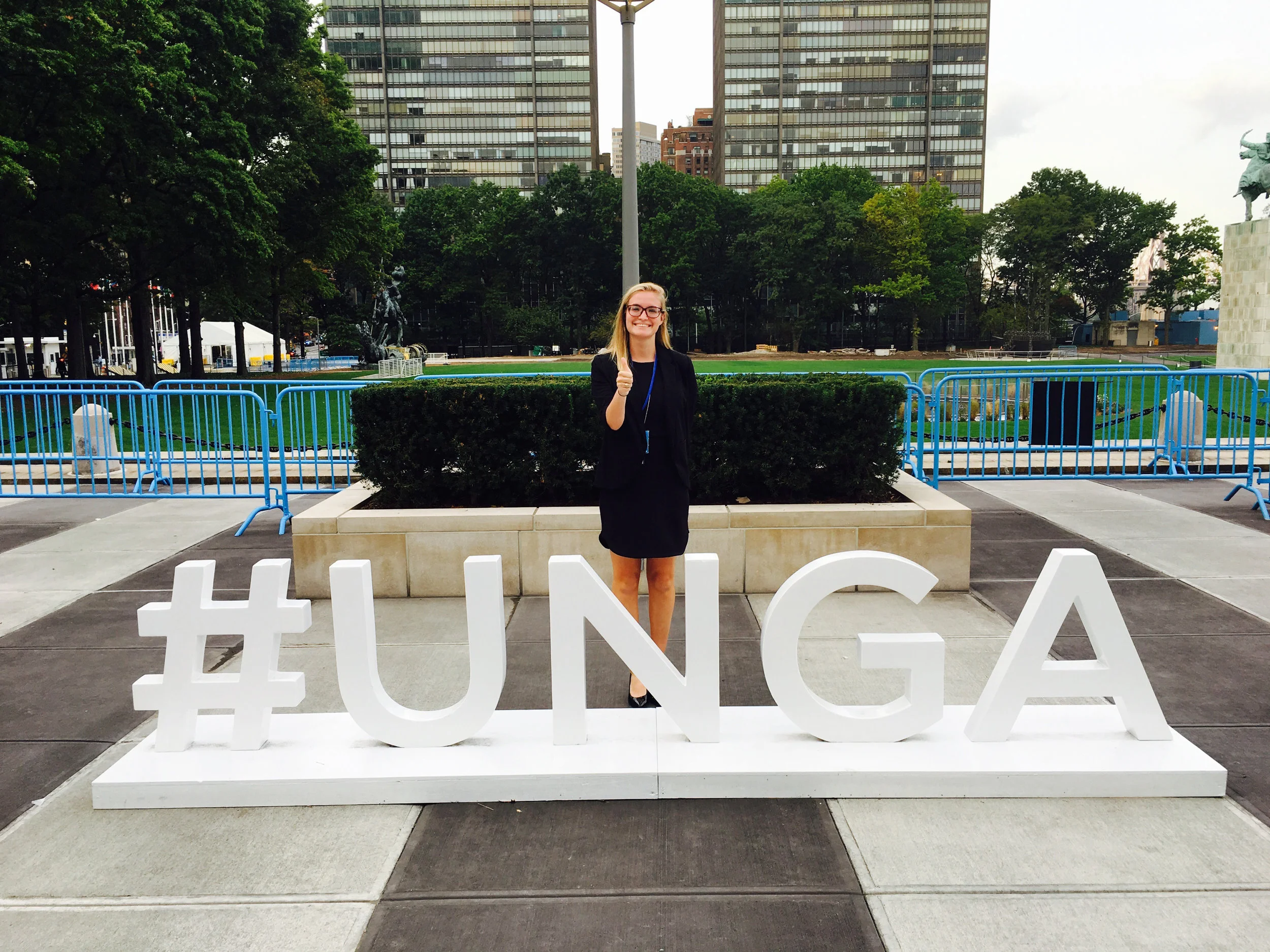 ^ In 2016, Paige posed by the UNGA (UN General Assembly) sign set up in New York.