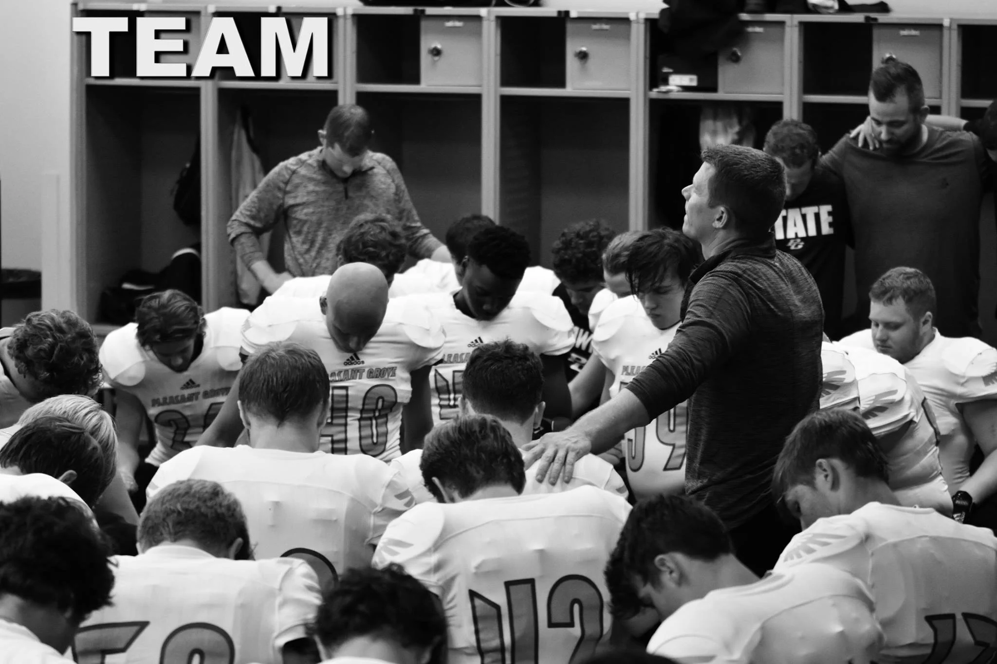 ^ Josh and members of the Pleasant Grove Hawk team during a pre-game prayer.