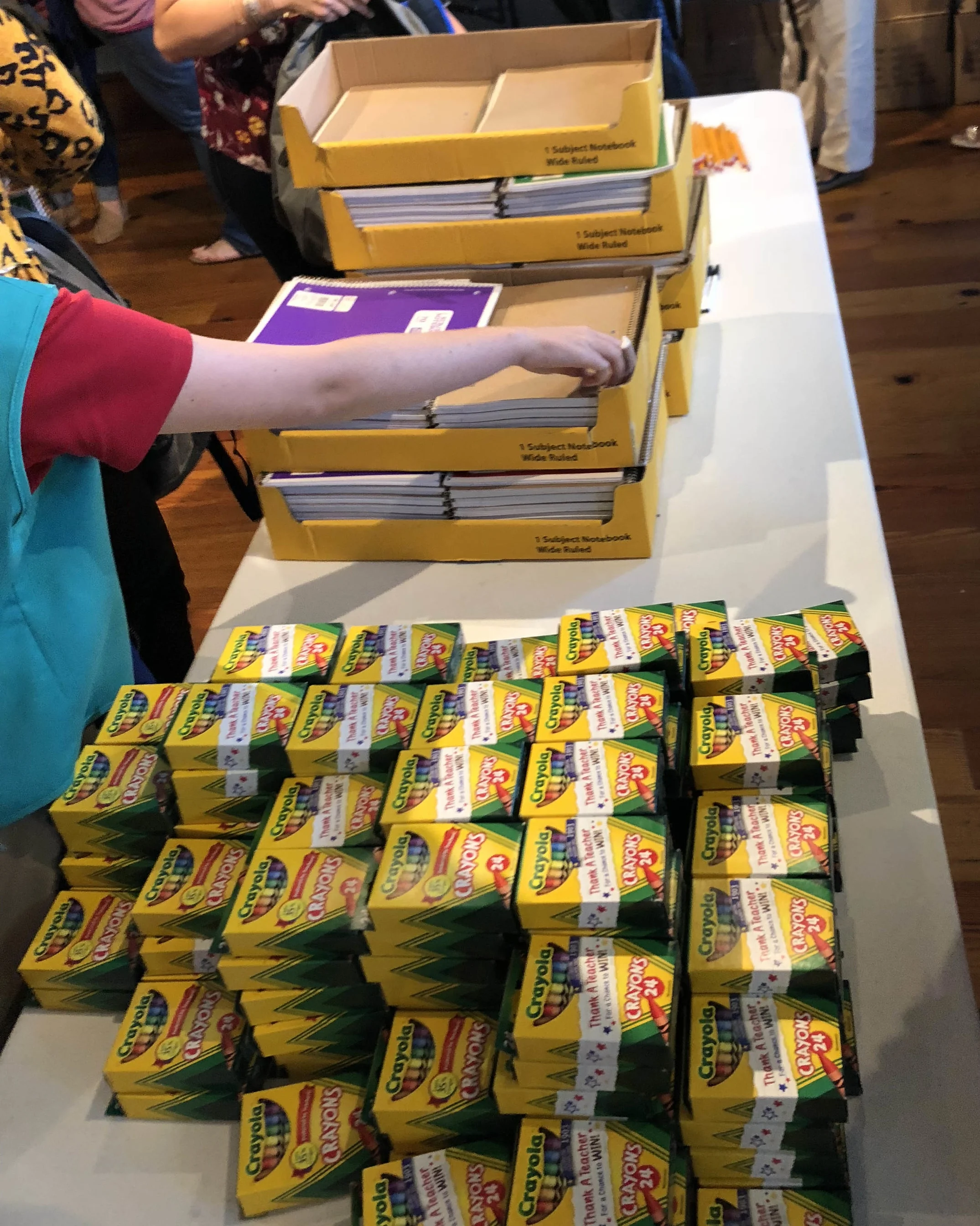 ^ During a recent general Junior League meeting, members assembled items for their Packs with a Purpose project. These backpacks are given to displaced children in foster care and/or kinship care and contain comfort items and living essentials which assist in maintaining a child’s dignity.