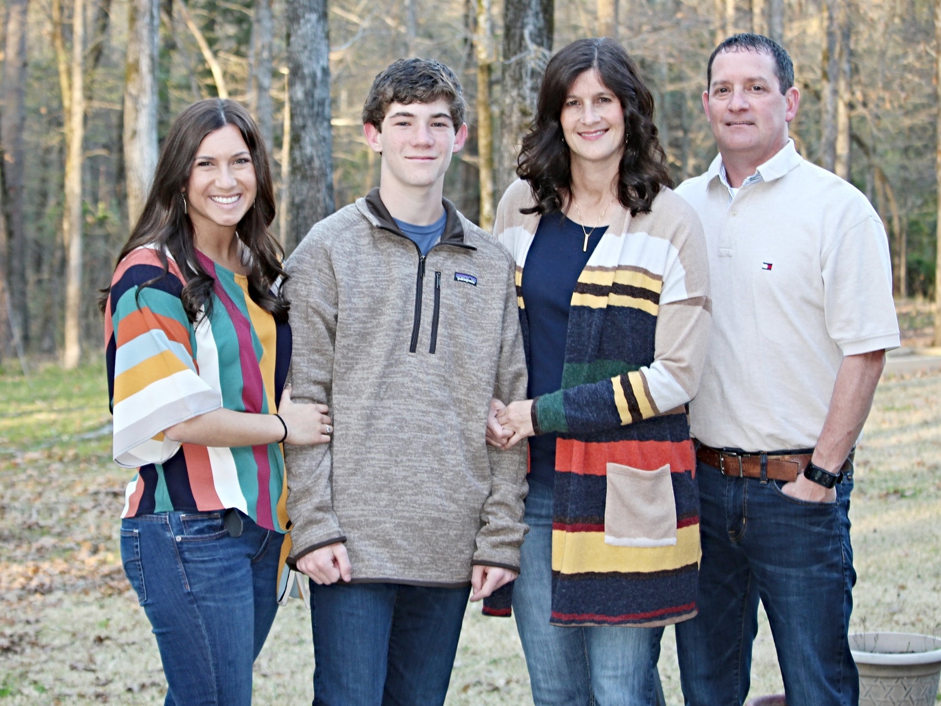 Gina with her daughter, Ashlyn; son, Brenton; and husband, Doyle, enjoying a beautiful spring day in their backyard.