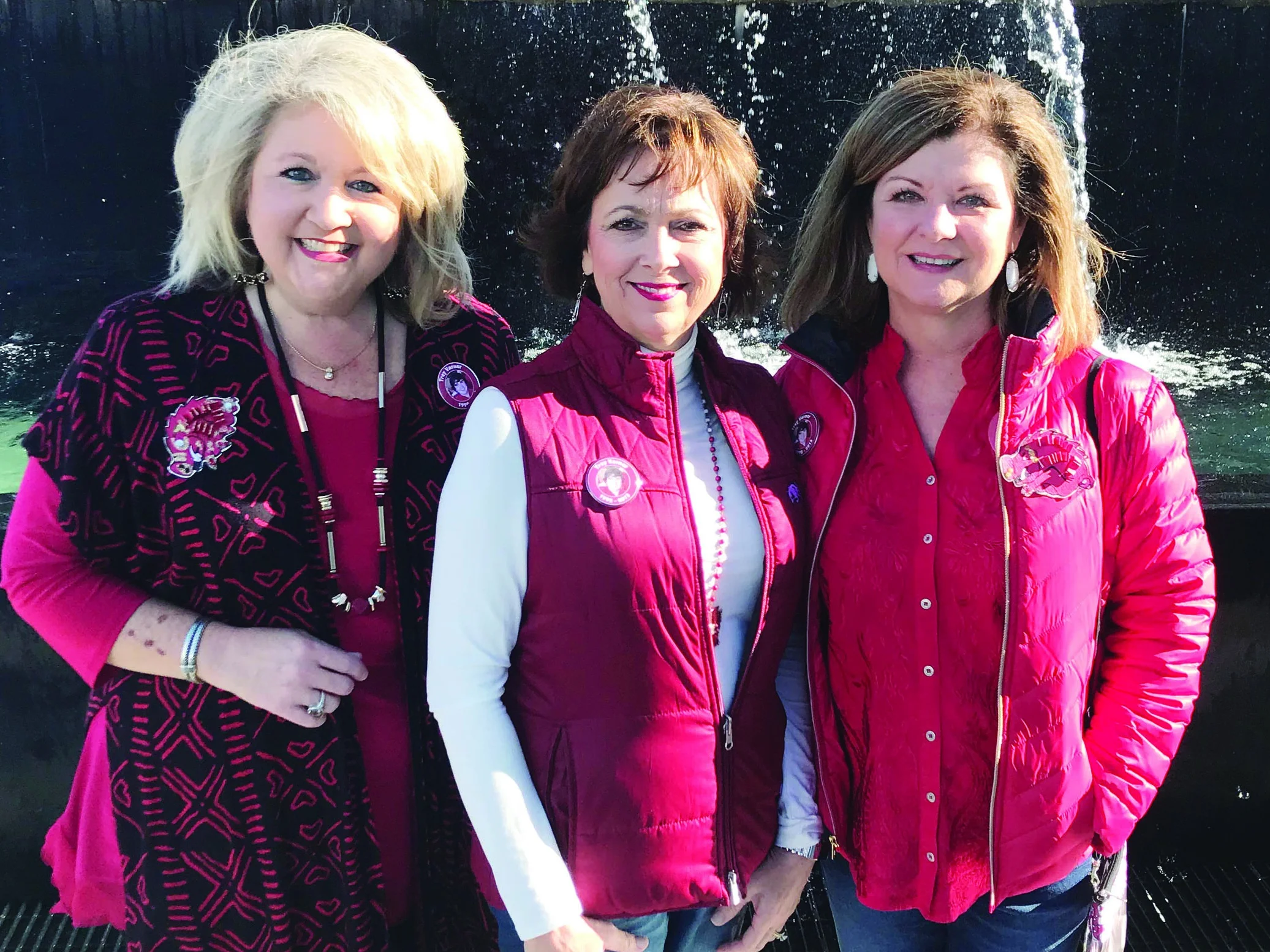 LeAnne Wright, Shelby, and Robin Hickerson during a University of Arkansas football game.