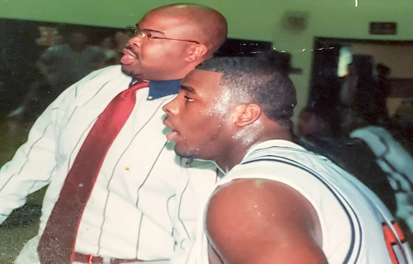 During the Queen City Bulldogs basketball season of 1999, Coach Davis converses with player, Jason Peters, who currently plays football in the NFL for the Philadelphia Eagles.
