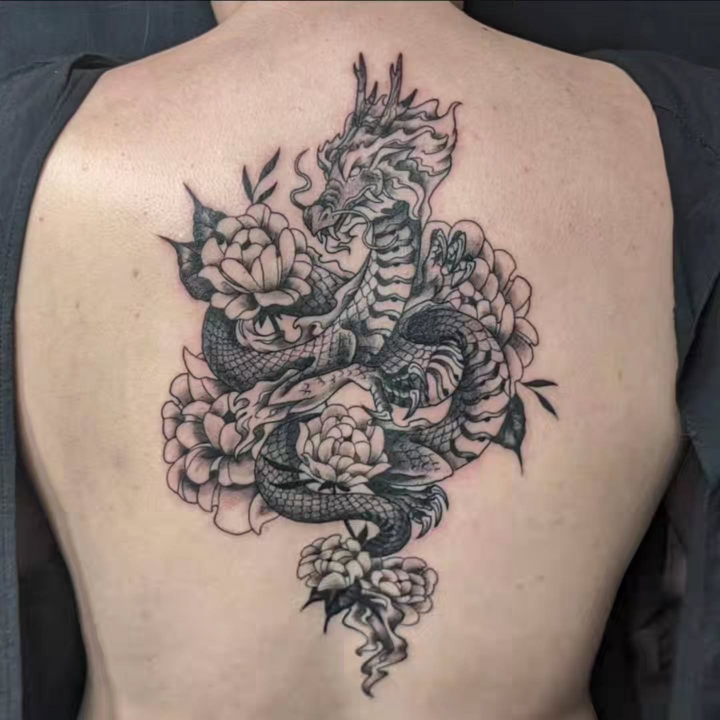 🐉A beautiful back piece by @amy.lo.ink 😍
.
.
.
Amy's books are open! Interested in scheduling with her? Fill out our appointment request form in our bio to get your next tattoo started! ✌️