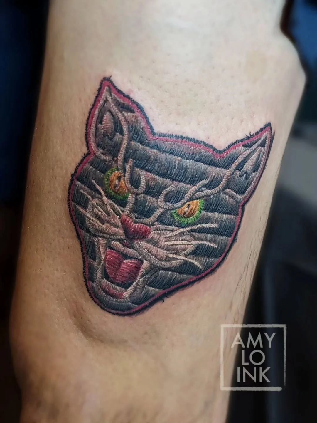 @amy.lo.ink Stitched together this tattoo the other day 🪡🧵 

You may or may not recognize this iteration of the Black Cat Firecrackers logo that you may or may not know from hiding in ditches and setting off with your cousins. That's certainly not 