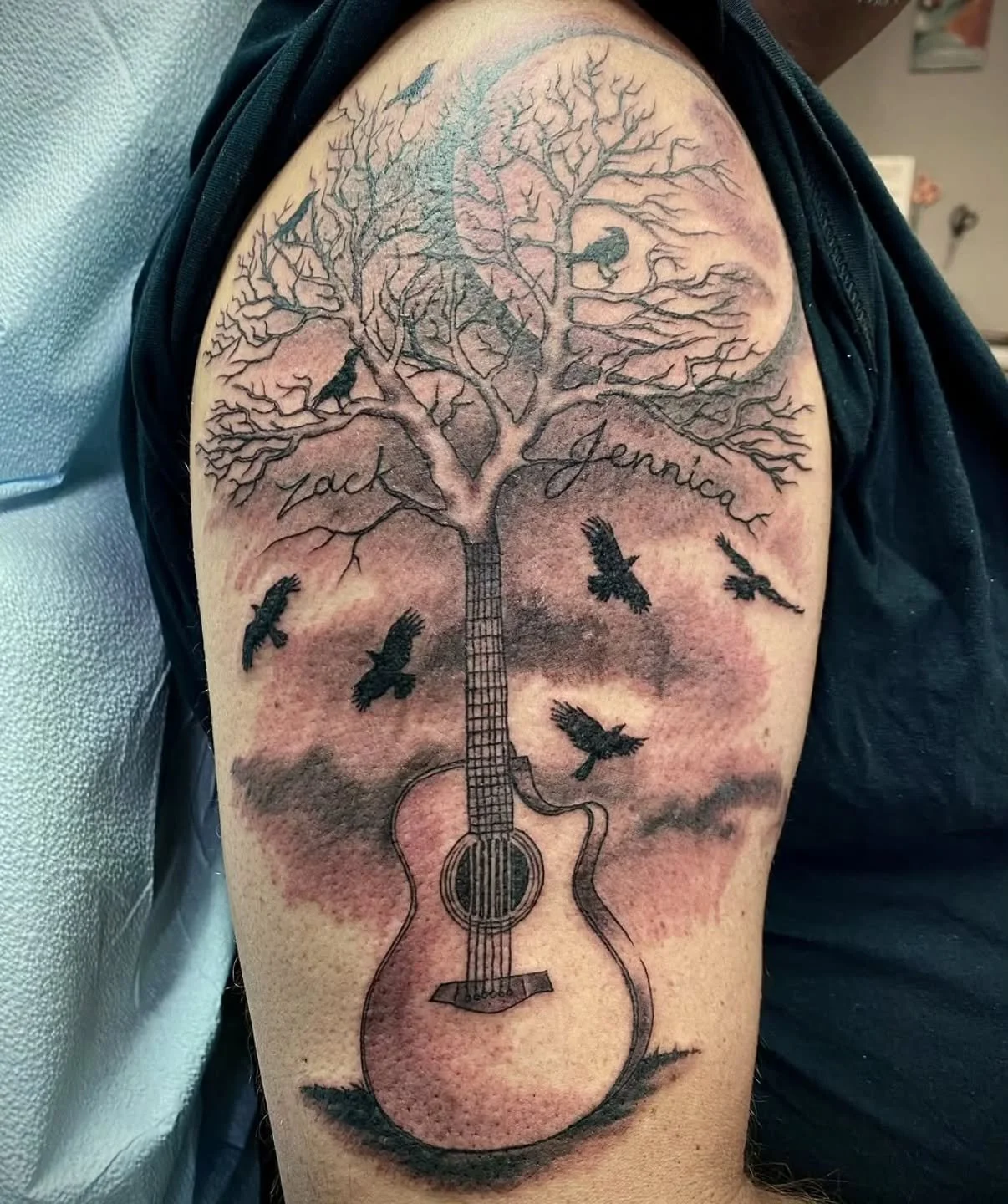 &bull; @keithmullintattoos&bull; This was a fun one from awhile ago. Black and grey acoustic guitar morphing into a tree with kids names.
.
.
Raven's Head Tattoo 
242 Dundas Street 
London Ontario 
519-601-2400