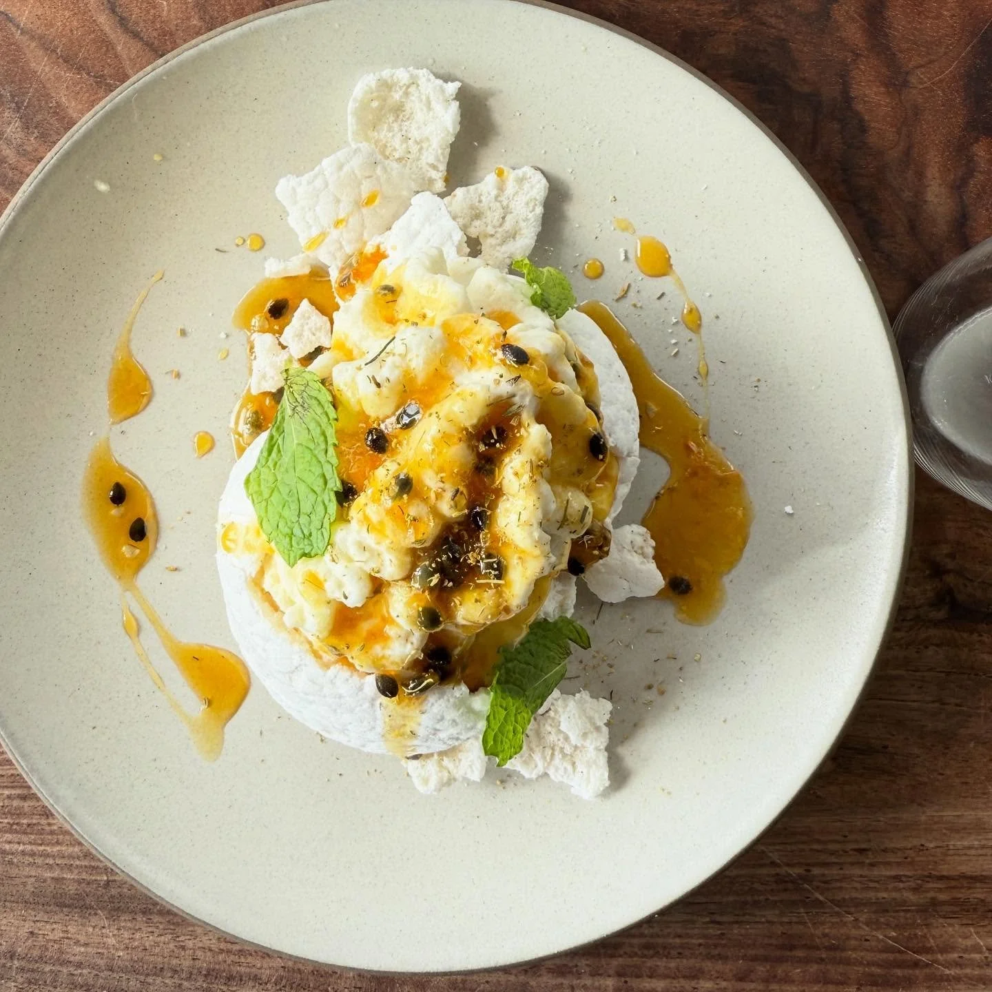 Everyone&rsquo;s favorite passion fruit Pavlova is BACK!!! Serving it this year with a white chocolate Chantilly cream, @giffinfamilyranch passion fruit curd, and passion fruit agrodolce (tart honey syrup) by @oscar_desantiago_ ✨✨ Pav made with Munak