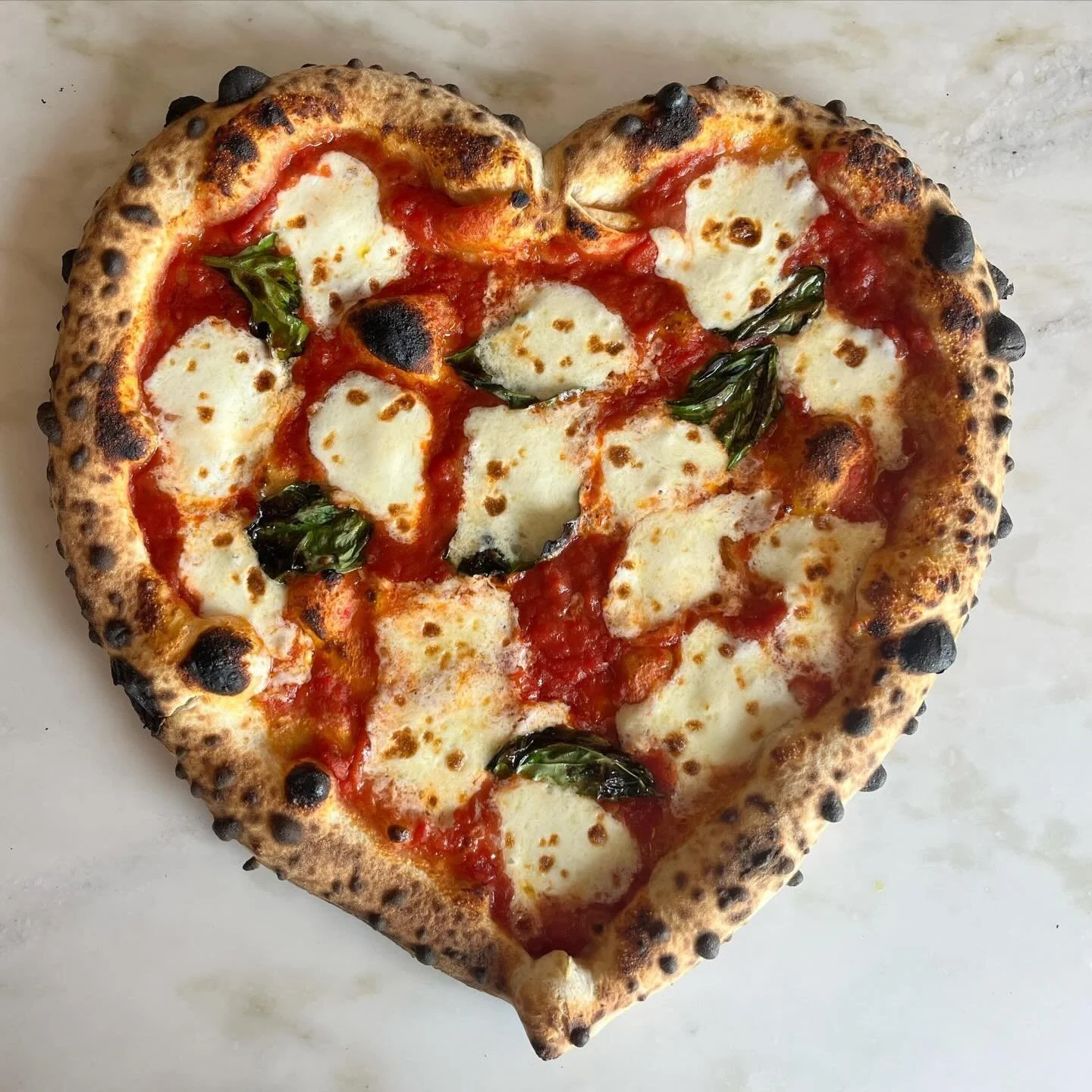 Happy Valentine&rsquo;s Day weekend!! Our heart shaped pizzas start today at both locations! They are by request over the phone and online. If online, you&rsquo;ll be able to modify your pizza to heart shaped in the &ldquo;no slice option&rdquo; sect