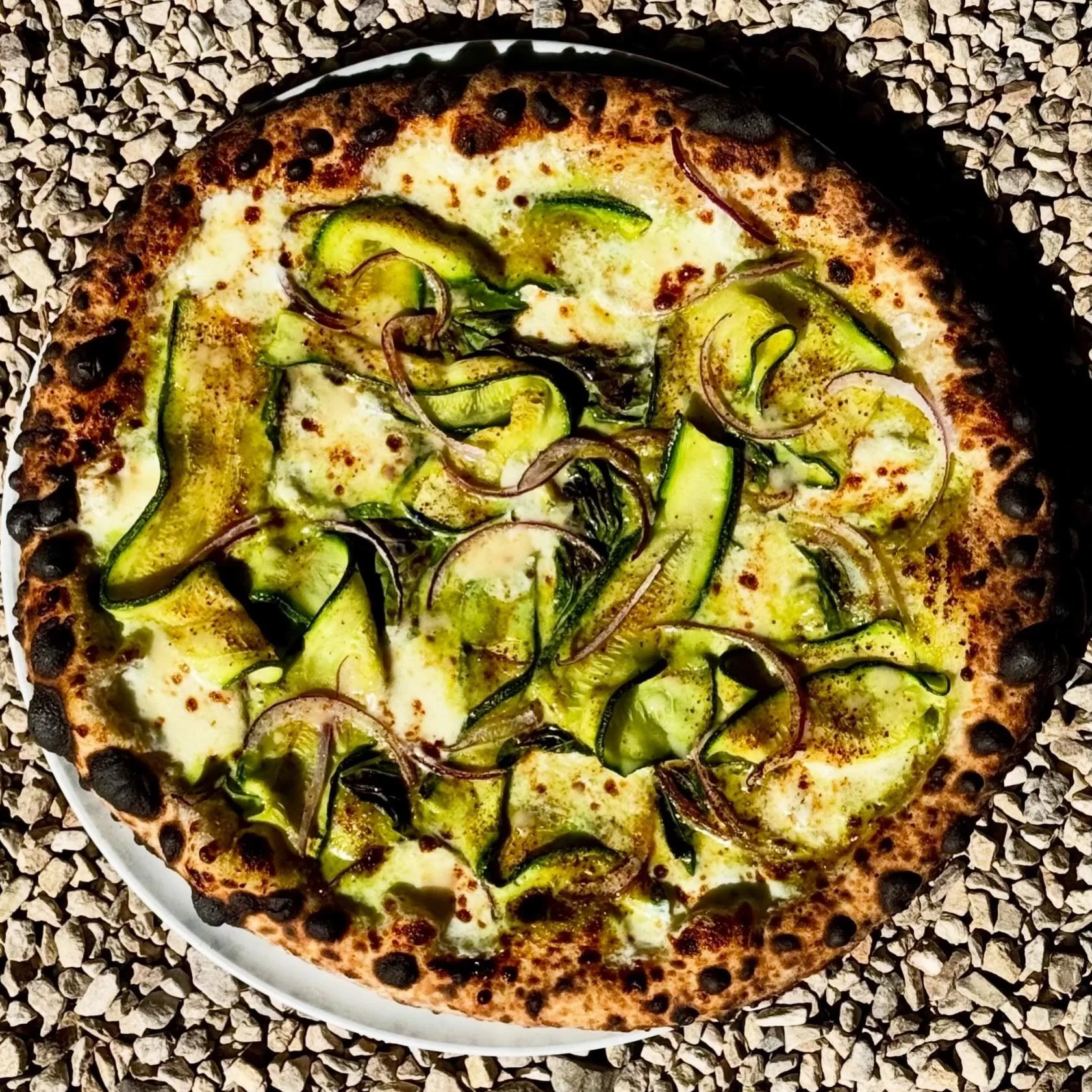 Zucchini is back as we float into late Spring. Hard to believe we are already into May! This beauty by @sadisticshark &amp; @oscar_desantiago_ has Munak farms zucchini, a spring onion cream base, red onion &amp; @burlapandbarrel sun dried tomato powd