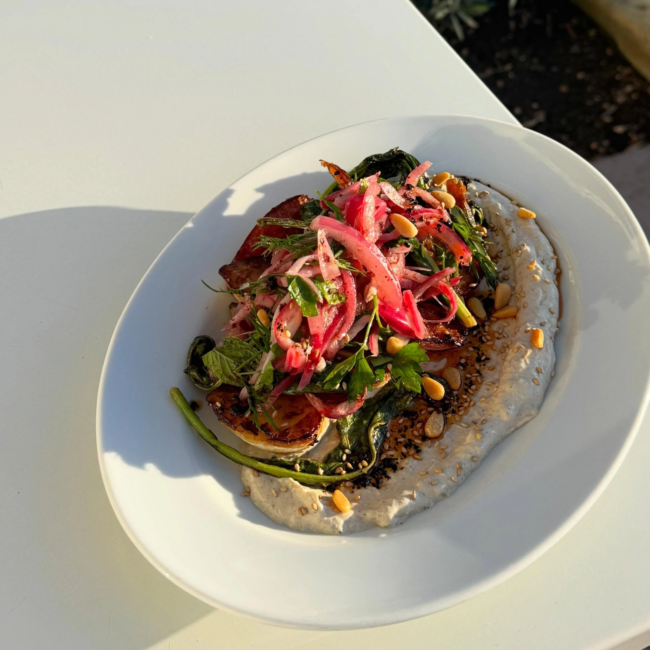 Our amazing chef @oscar_desantiago_ has done it again with this insanely delicious @the_garden_of_ roasted turnip dish with whipped tahini, @burlapandbarrel Urfa chili oil, sumac onions and pine nuts. On for dinner only starting tonight! Xoxox