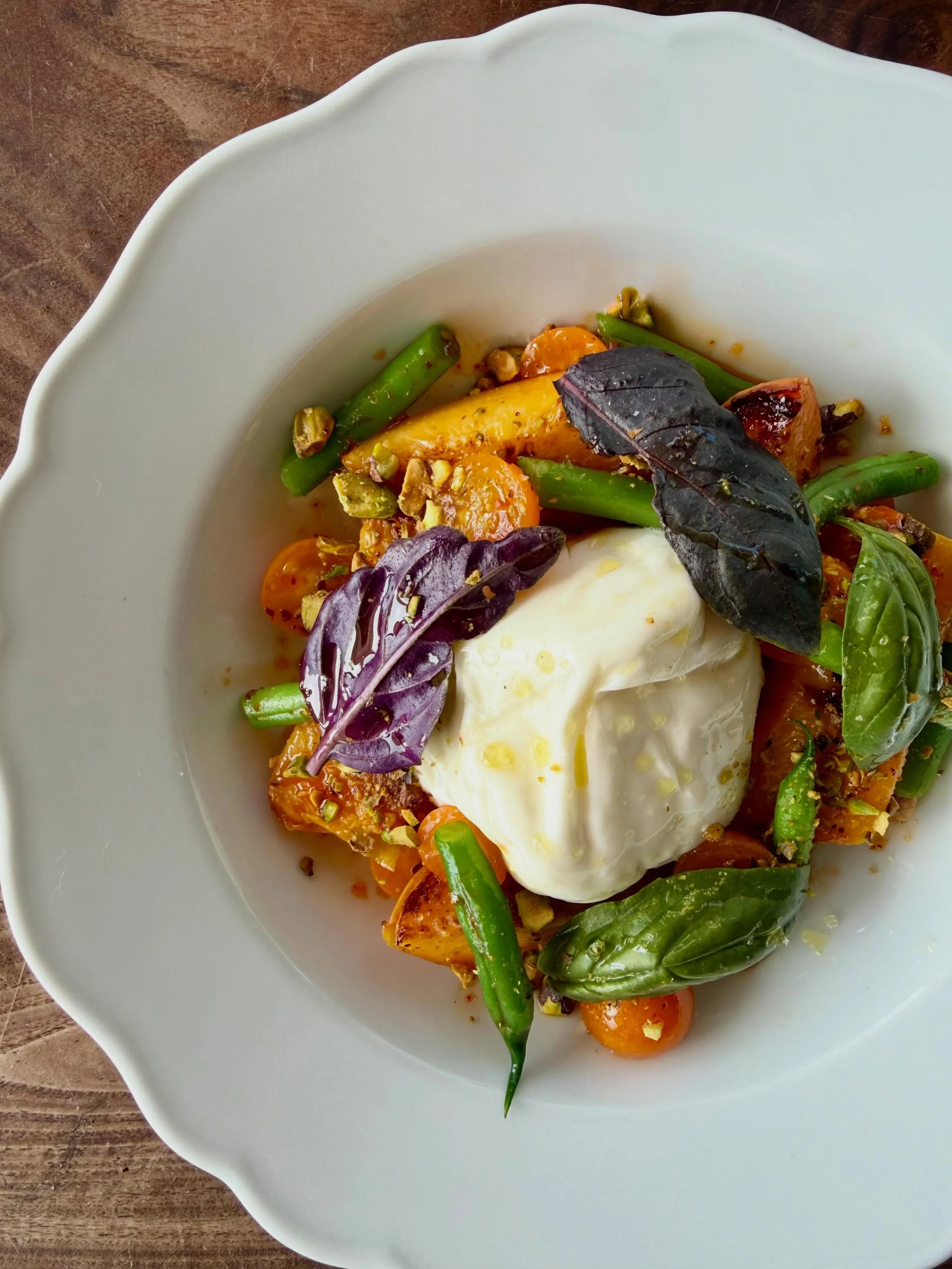 Peaches. Not yet on pizza but in this gorgeous burrata dish. We&rsquo;re roasting the @regierfamilyfarms peaches to naturally enhance their sweetness and serving them with always @gioiacheeseco burrata and a salad of Munak cherry tomatoes and Her gre