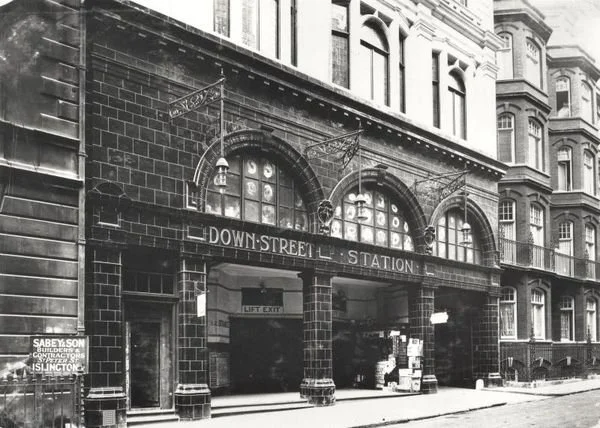 Down Street Station exterior in 1907, featuring iconic ox-blood red tiles typical of Leslie Green designed stations throughout the network.

Photographer unknown, London Transport Museum.
