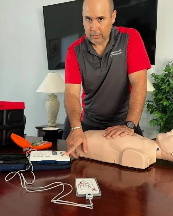 Instructor demonstrating AED response during CPR training