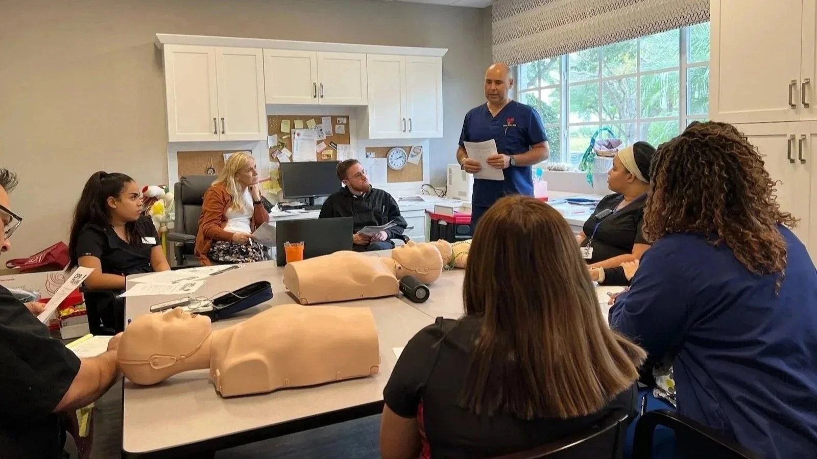 Instructor leading a hands-on CPR training class