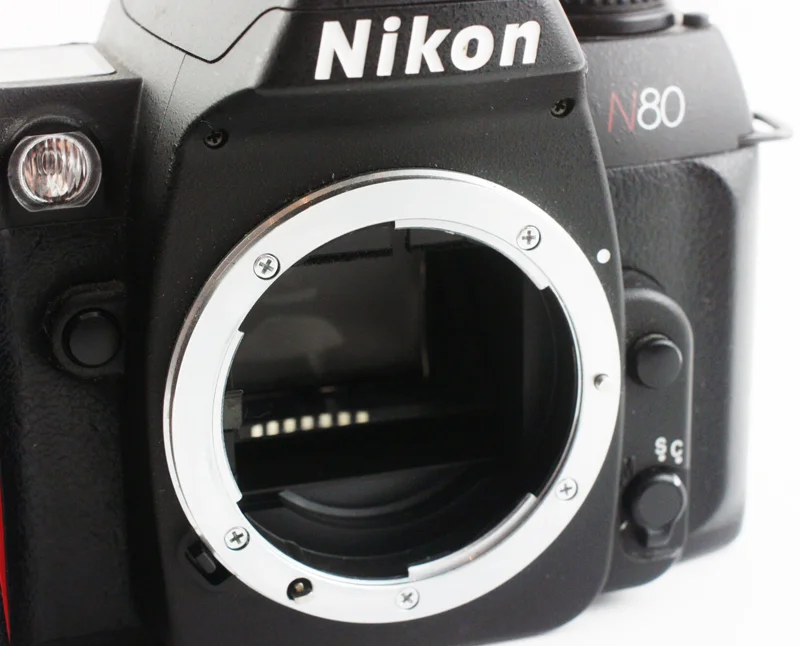 Some Nikon bodies lack the coupling lever, making them safe to mount both Non-AI and AI lenses. However, this is often done at the sacrifice of metering.
