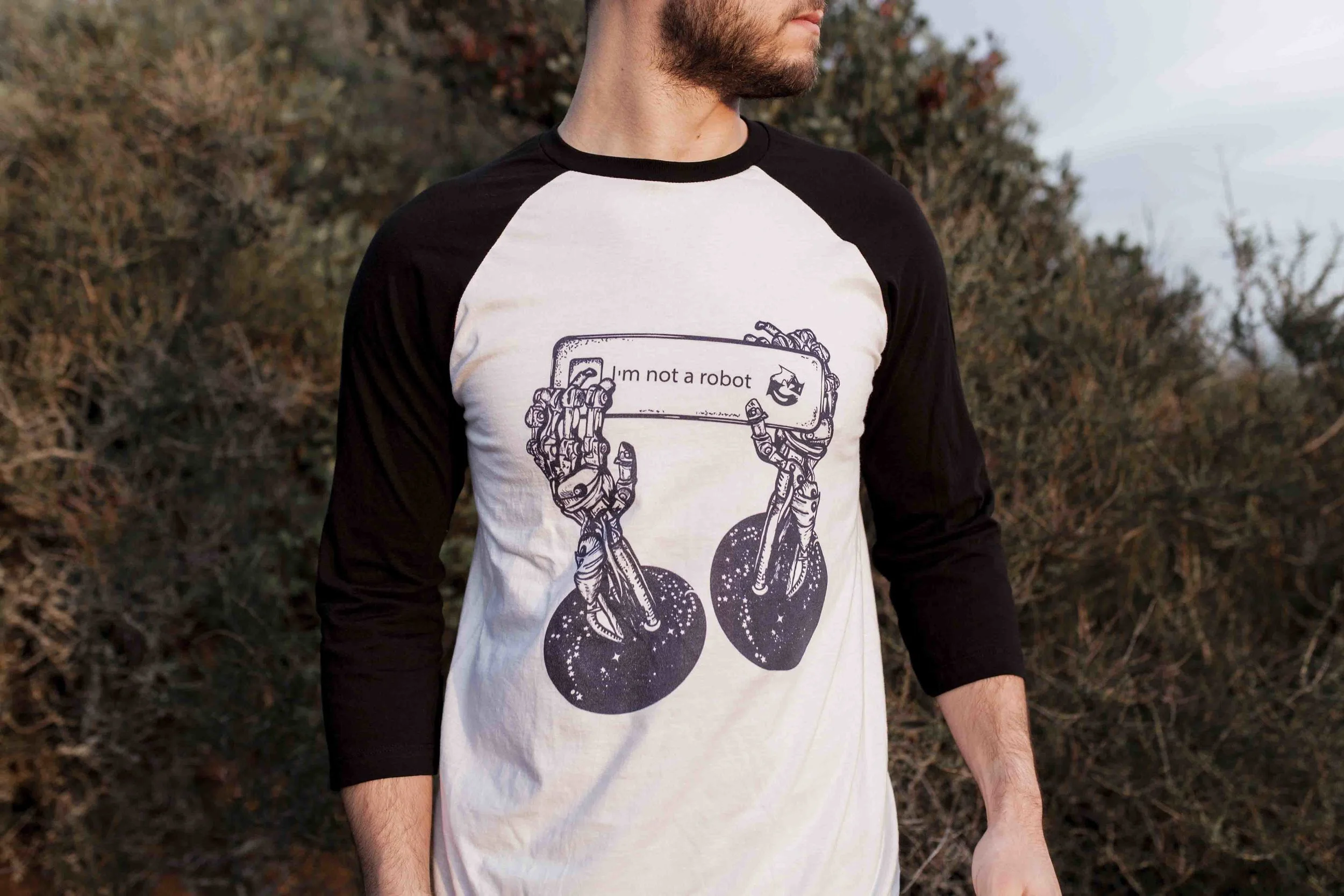 model wearing robot hand shirt