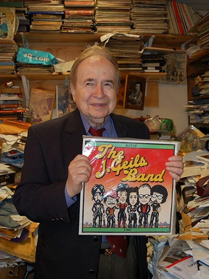 Joe Franklin (1926-2015) was a late-night TV talk show host, and his on-air presence was welcome companionship to NY illustrators on lonely all-night deadlines. He devoted an entire show to having The J. Geils Band on as his sole guests. And looky looky what he's displaying in his famously cluttered office! Thanks to Drew Friedman for sending me the photo.
