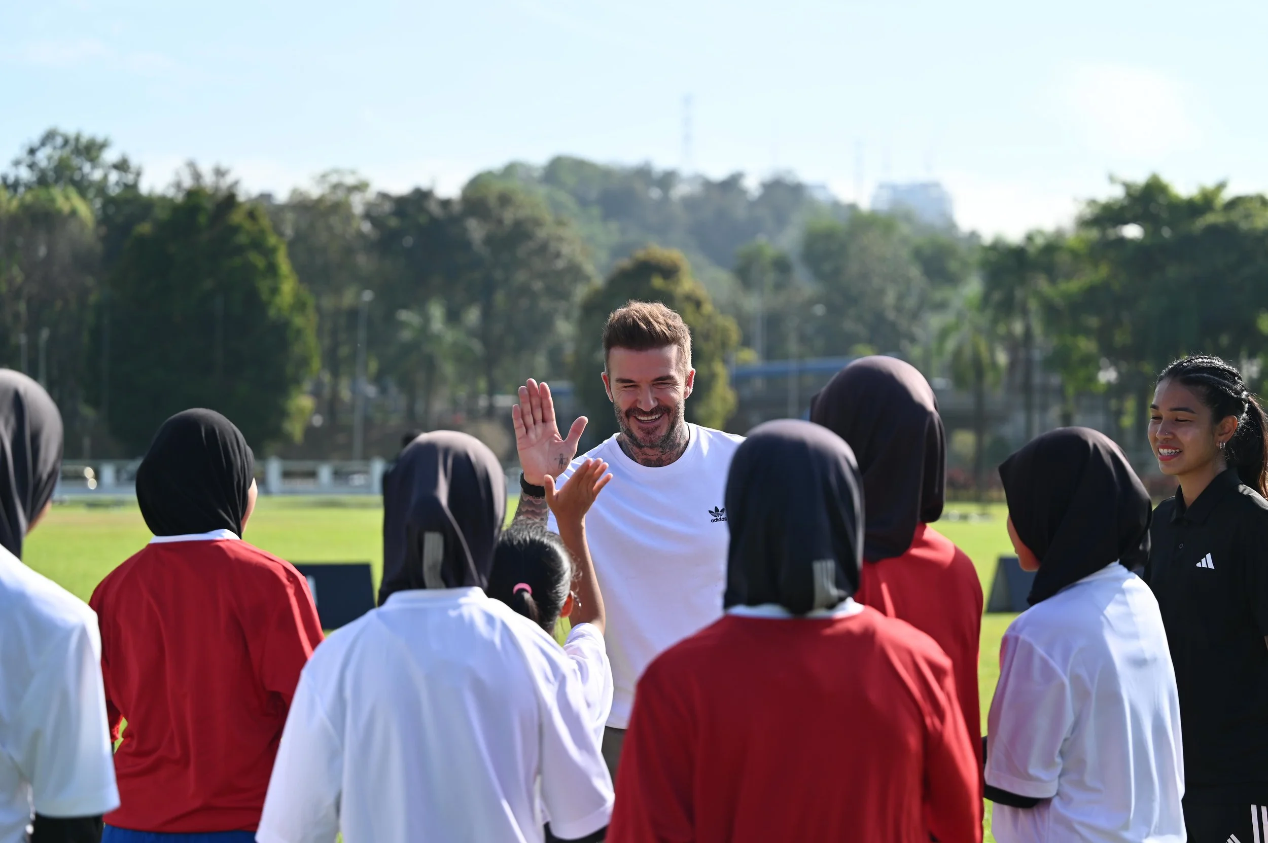  David Beckham interacting with the young female footballers after the training session at the launch of AMGFP 