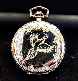 Great grandson wanted to preserve the story of the pocket-watch. Lightly engraved a pheasant and Art-Deco scrolls to keep the watch close to the same era and preserve the ‘antique’ look.