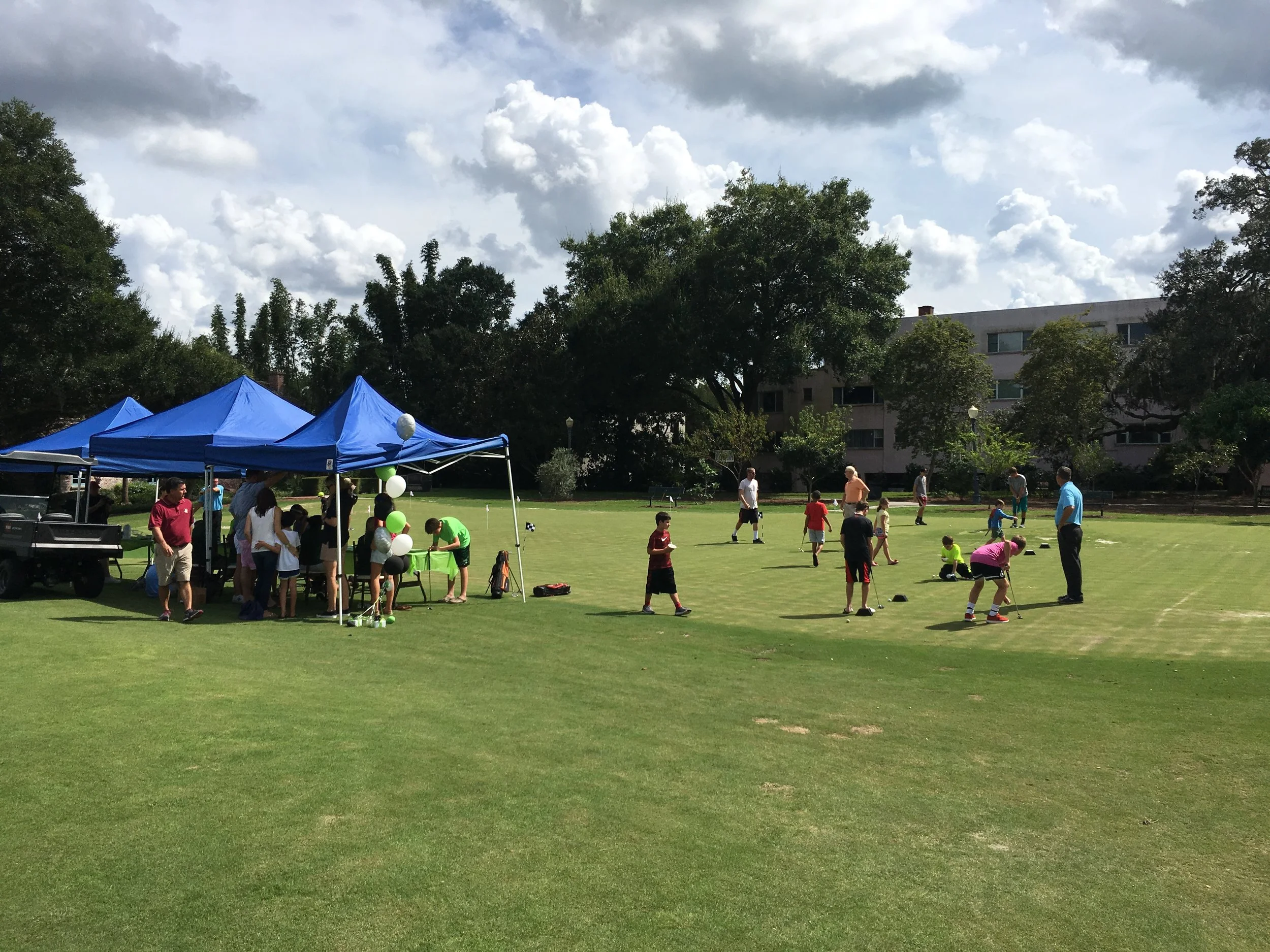Kids putting around on the new family putting course.