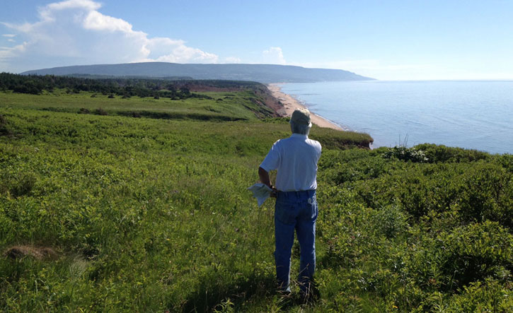 Bill Coore looking over what will become Hole 18,11,1, and 10