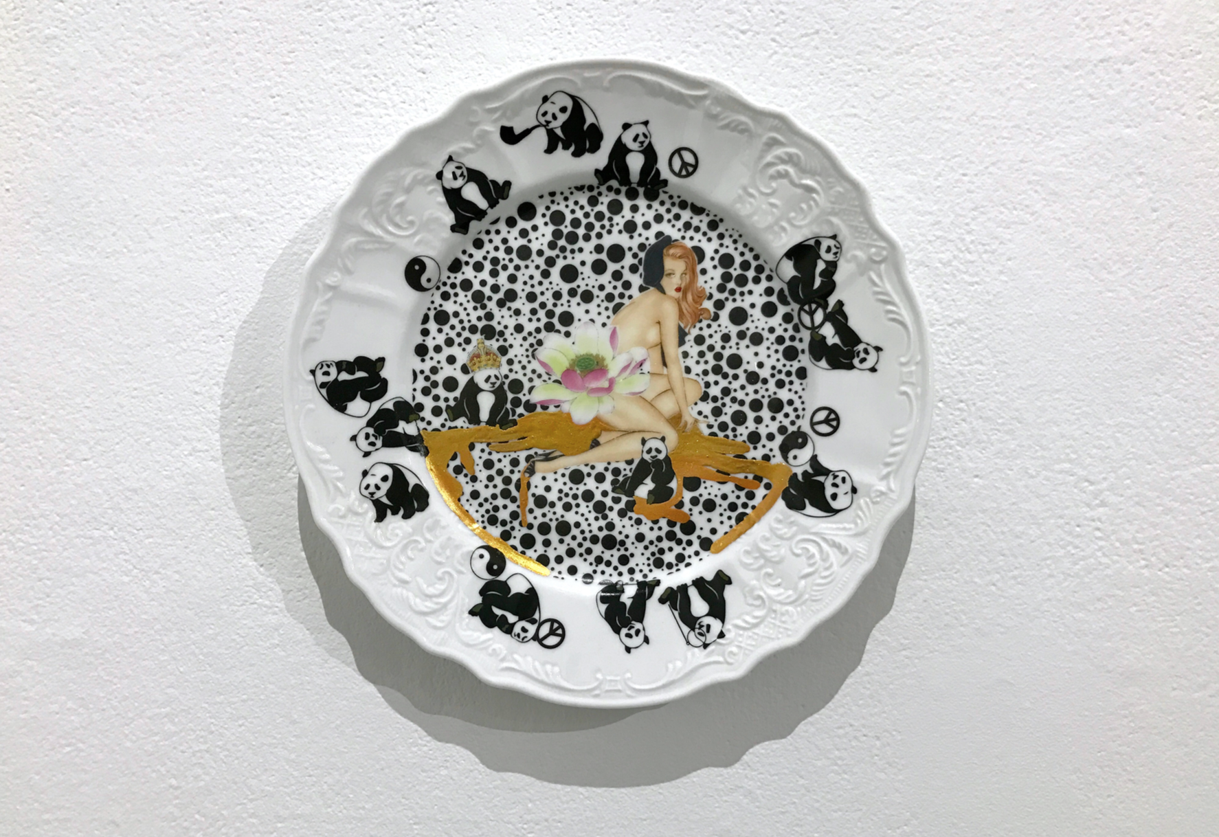  All You Can Buy (1/15), 2016, ready-made porcelain Plate, ceramic decal, gold leaf, lacquer 11”x11” 