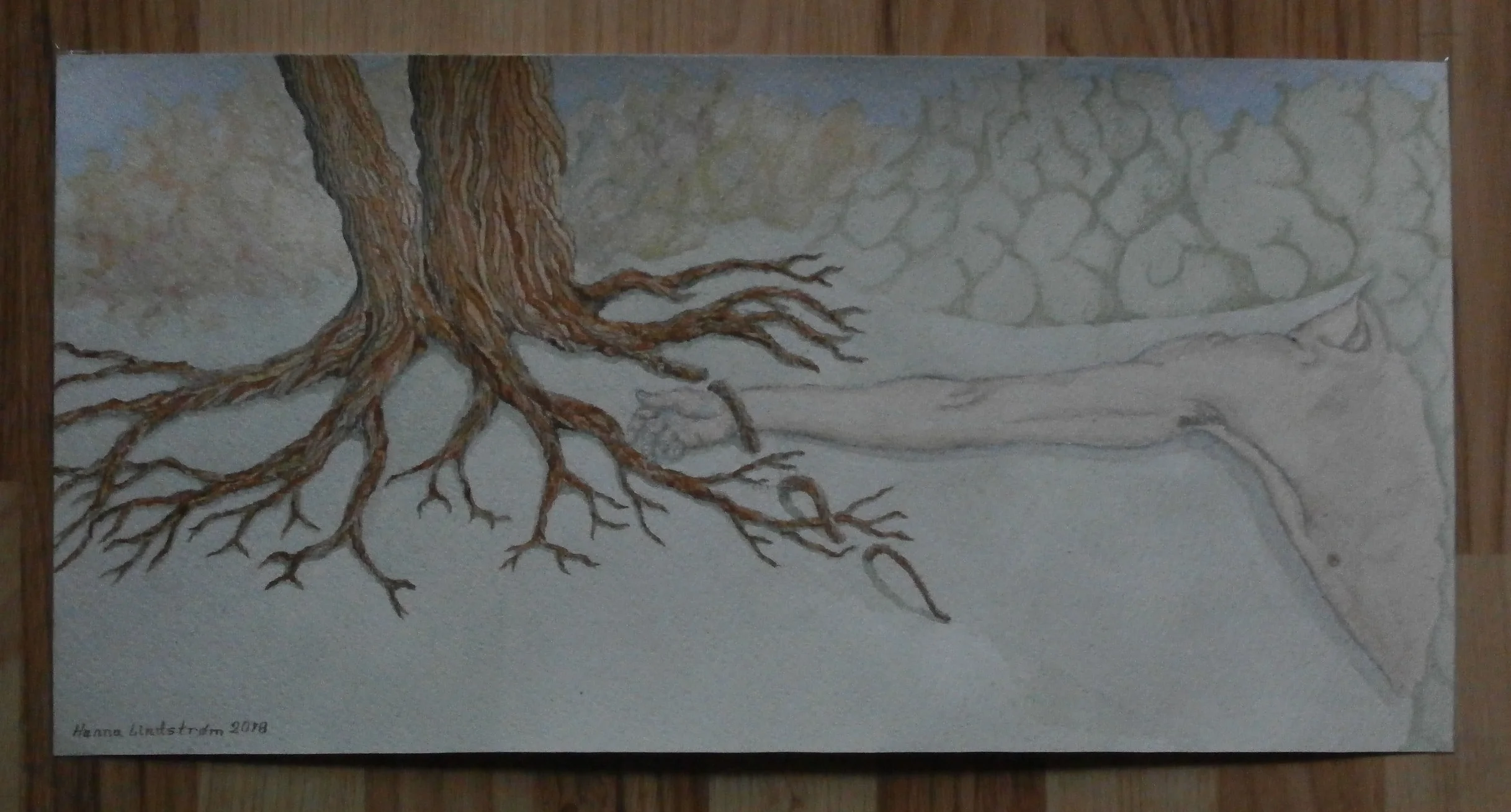 Liggende mand i skoven, lænket af trærod