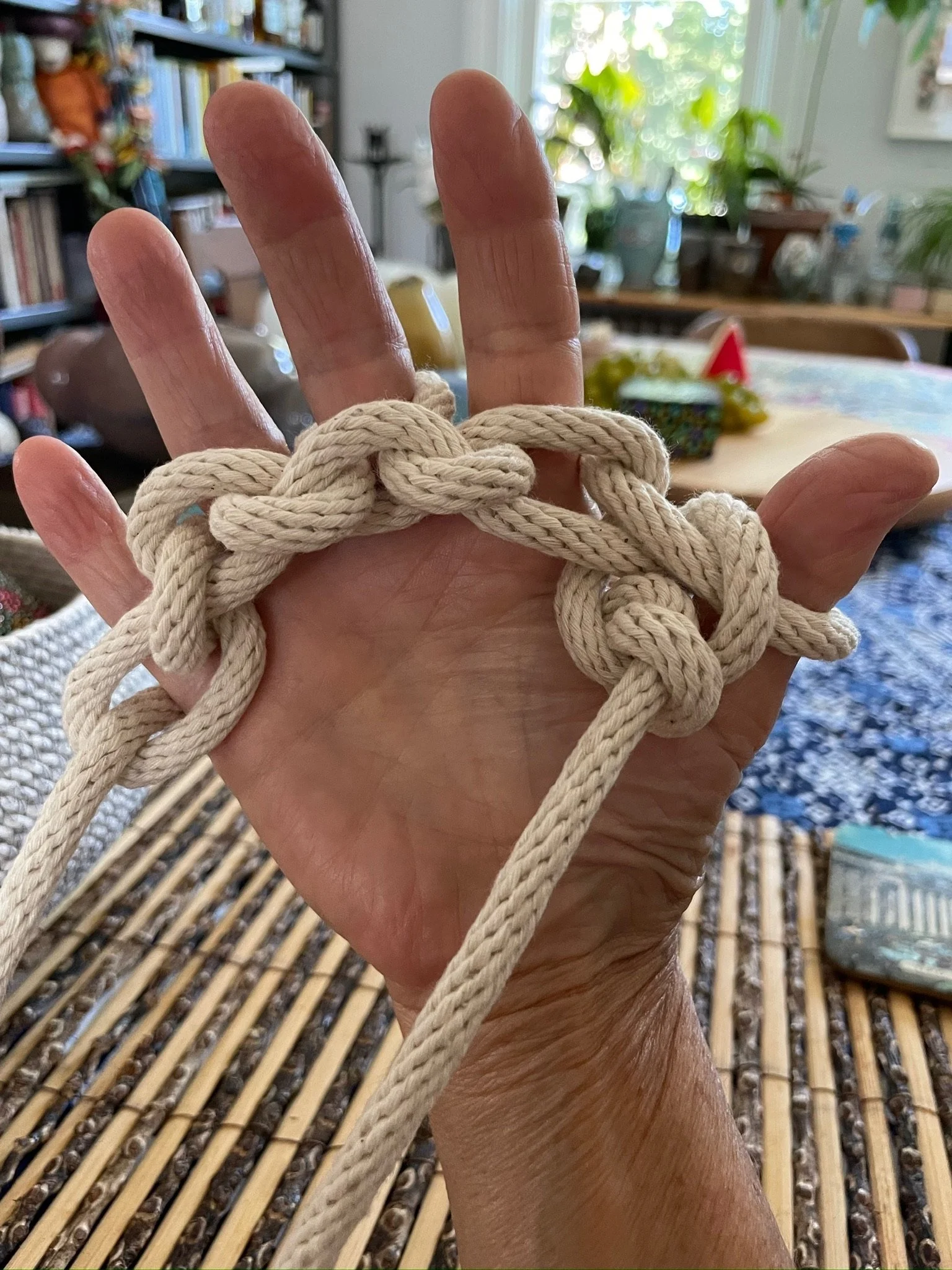  Thousands of feet of rope were hand-knit to be wrapped around airplane cable to hold up the glass and ceramics. 