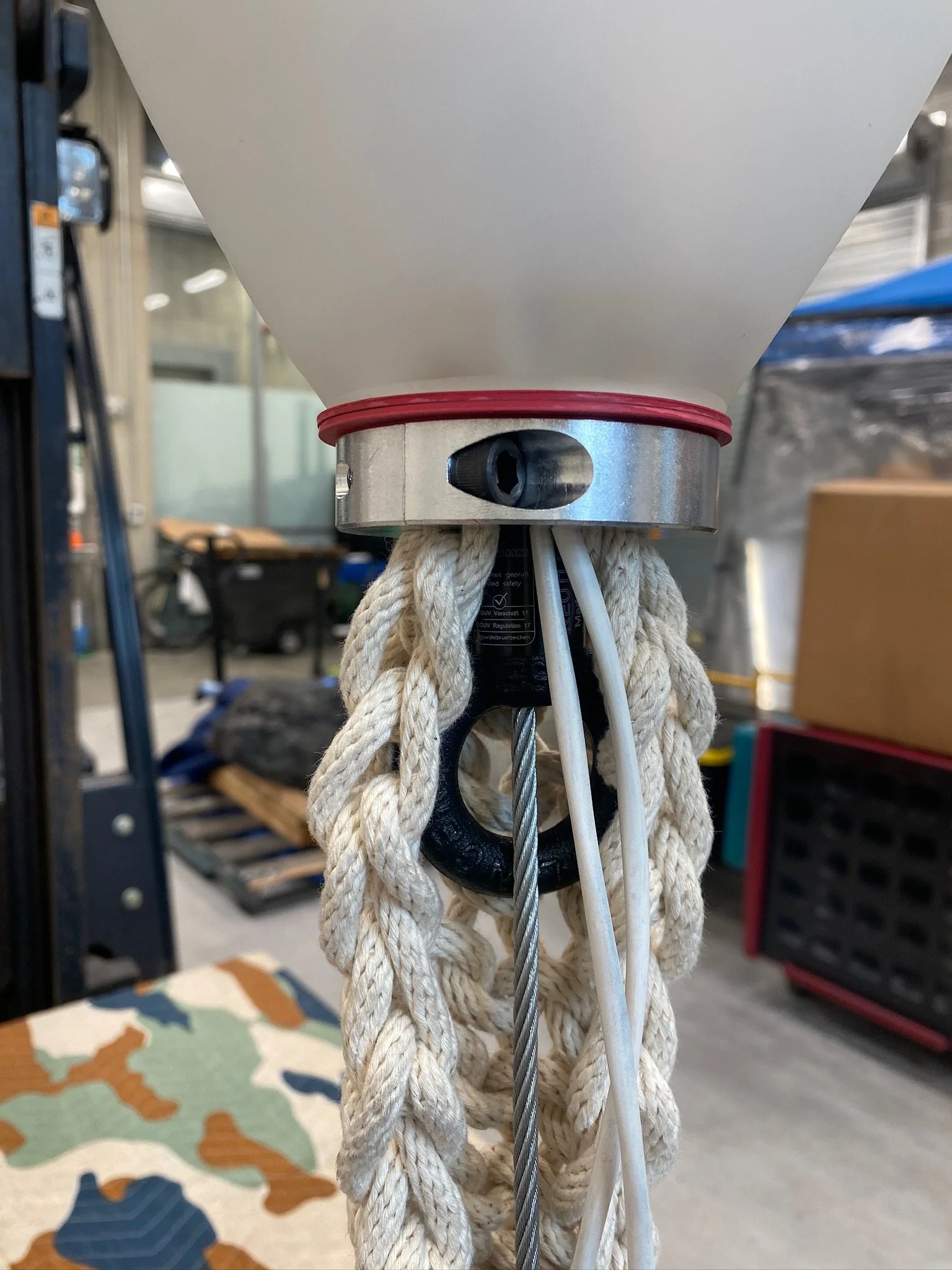  Hand-knit rope concealing airplane cables and speaker cables. 