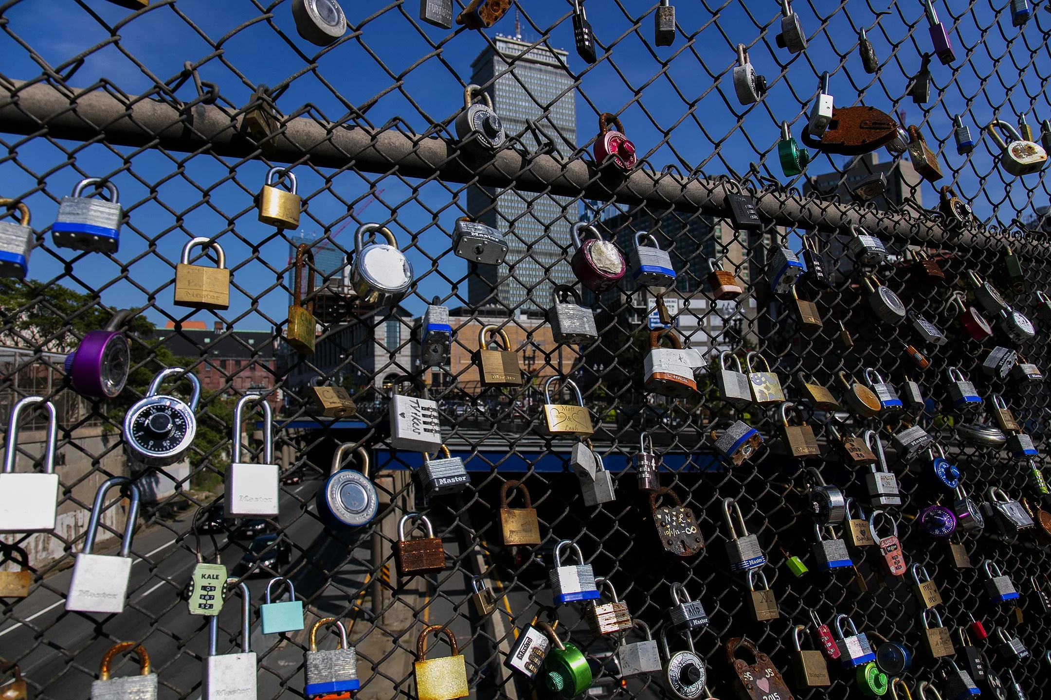  Locks adorn an overpass fence on Mass Ave. 