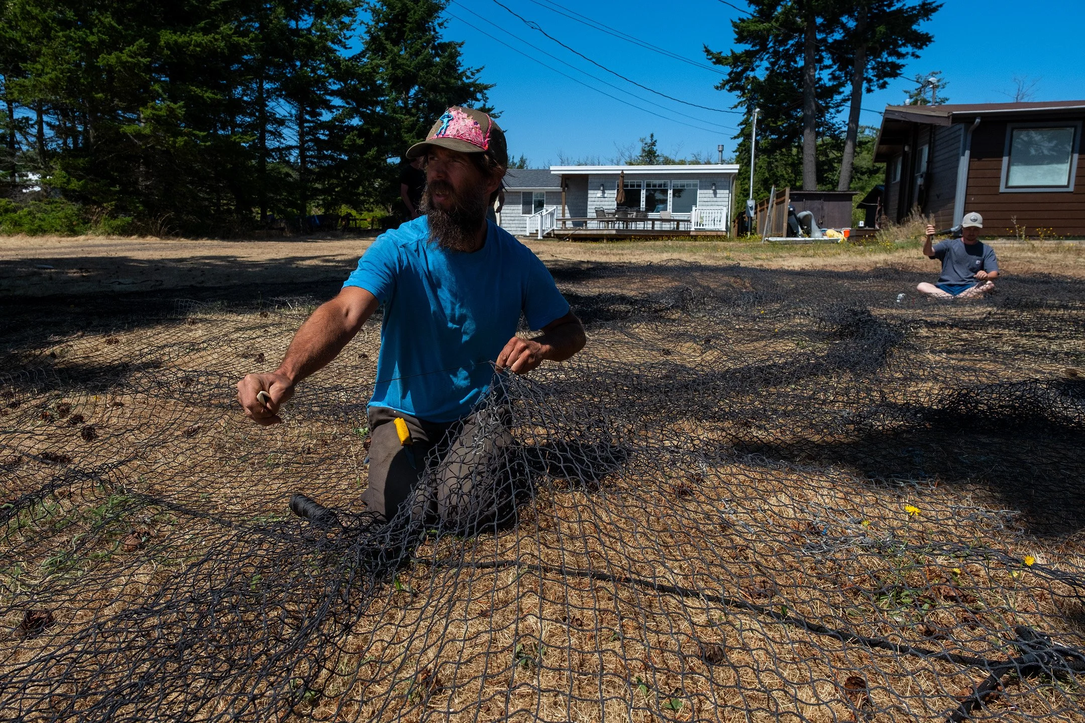 Stu makes repairs on the net before the season starts.