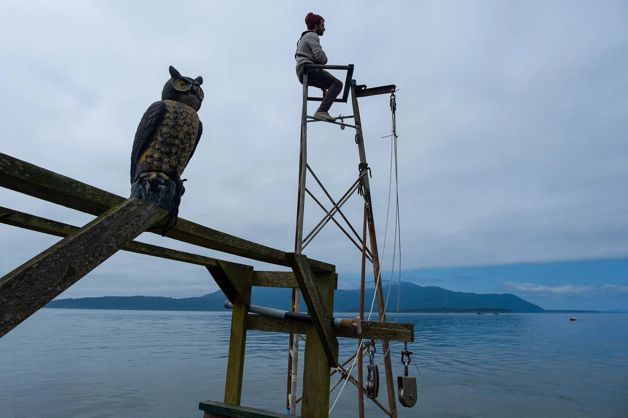 Matt sits on one of the lookout perches as the boat is towed out to its anchor.