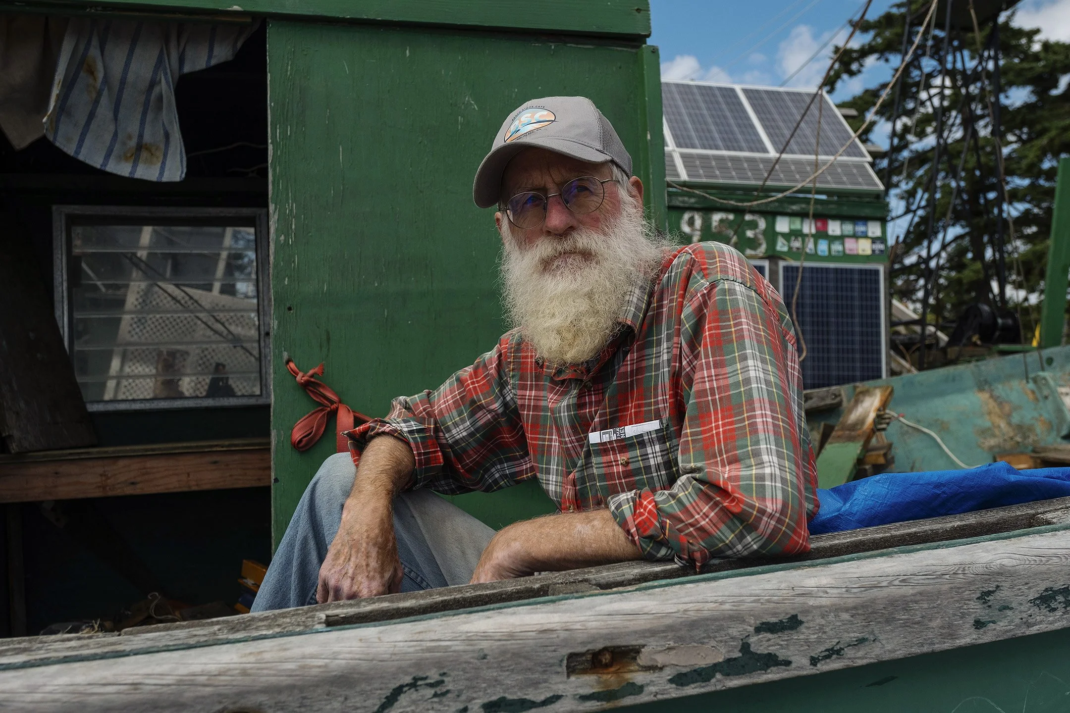 Jeff, a reefnet captain, sits in his gear before it is launched for the season.
