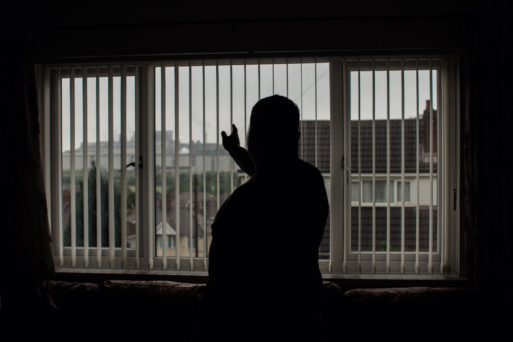 Karl points to the steel works that is visible from his lounge window. 