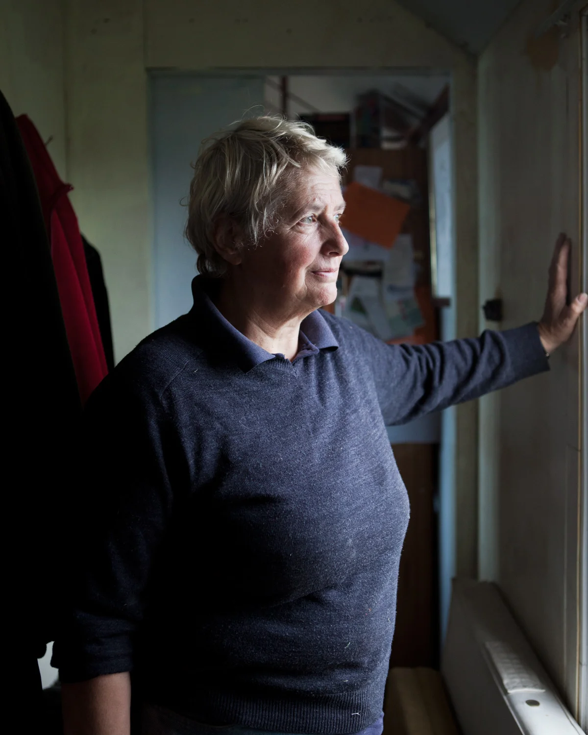 Bryony in her home that she bought in 2008; believing at the time that sea defences would be kept up and her house would be safe for a number of years. 