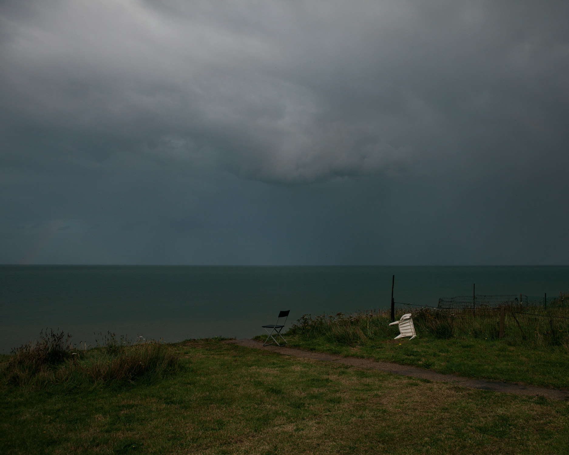 A storm brews in Bryony's back garden, half of which has been lost to the sea.