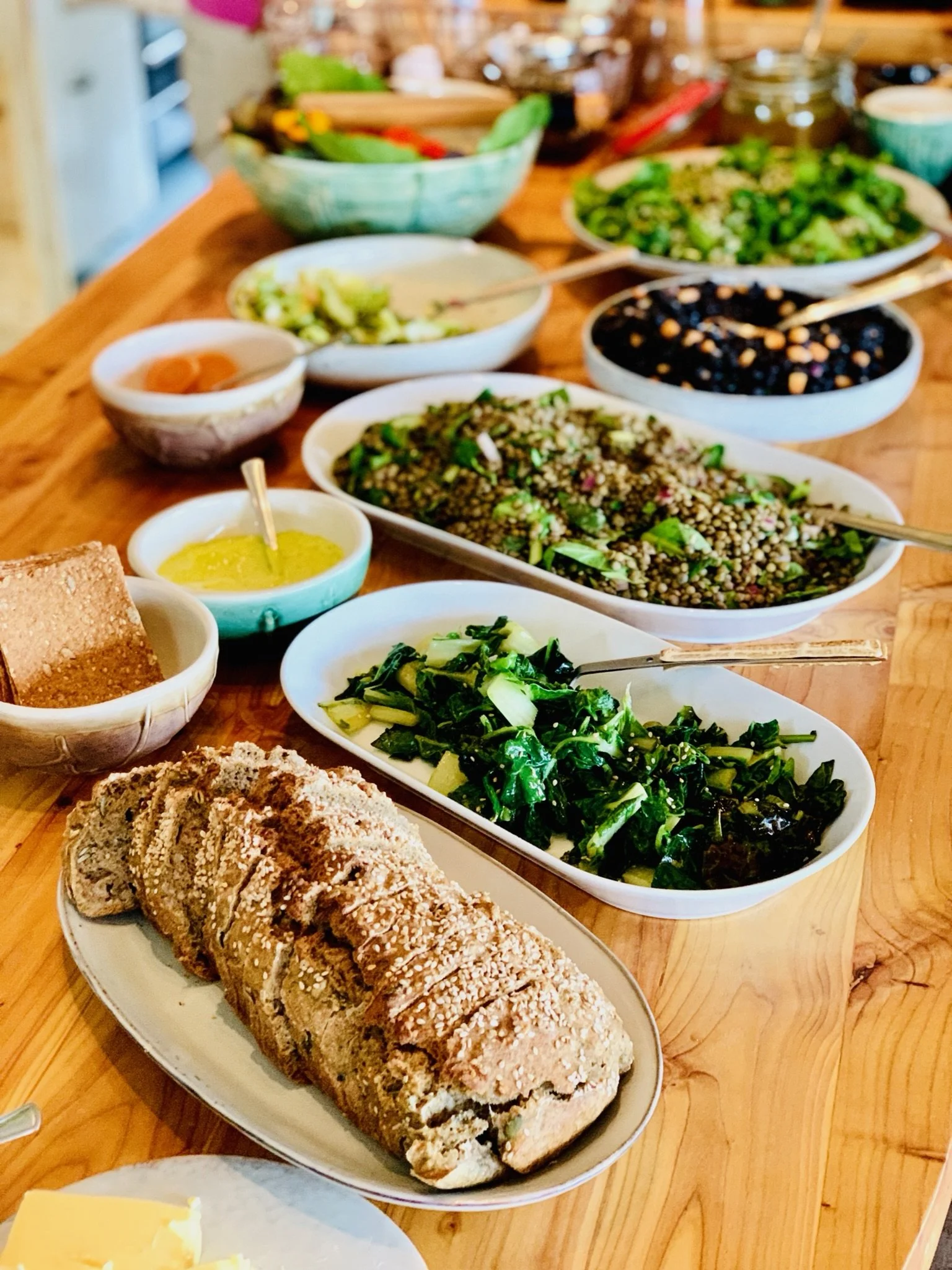 Nourishing vegetarian dishes of greens and grains, supporting the Ashram wellness lifestyle after hiking in Iceland.