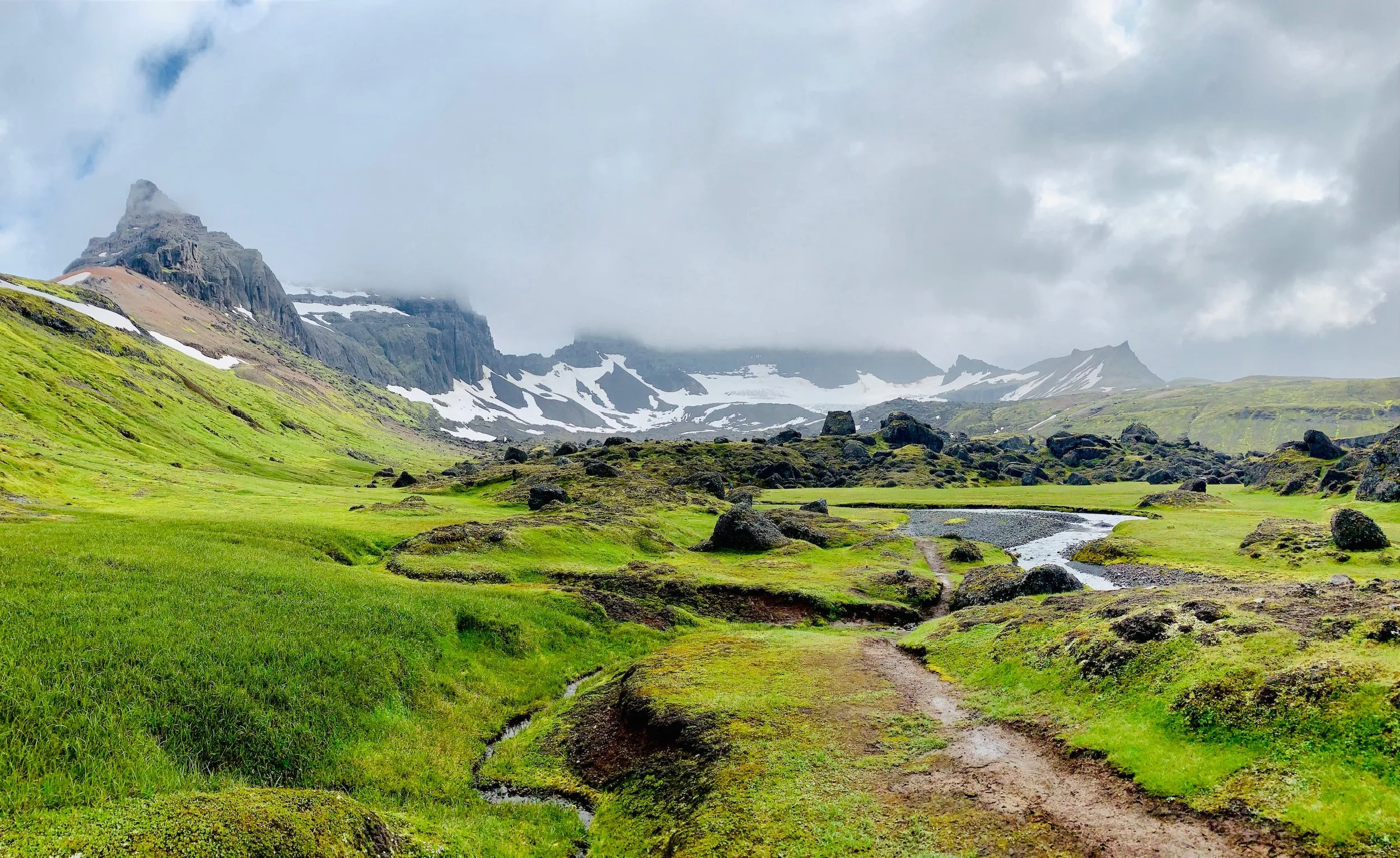 Dramatic mountain and glacier views on a spiritual hiking retreat in Iceland, one of the best treks in Iceland for hiking.